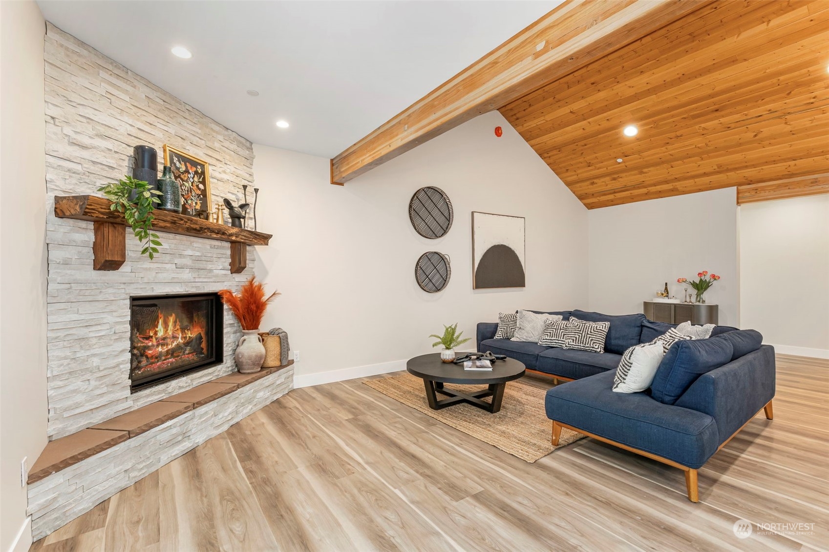 22086 Dewberry Road Northeast Indianola, WA 98342 - Photo 9 of 40 a living room with furniture and a fireplace