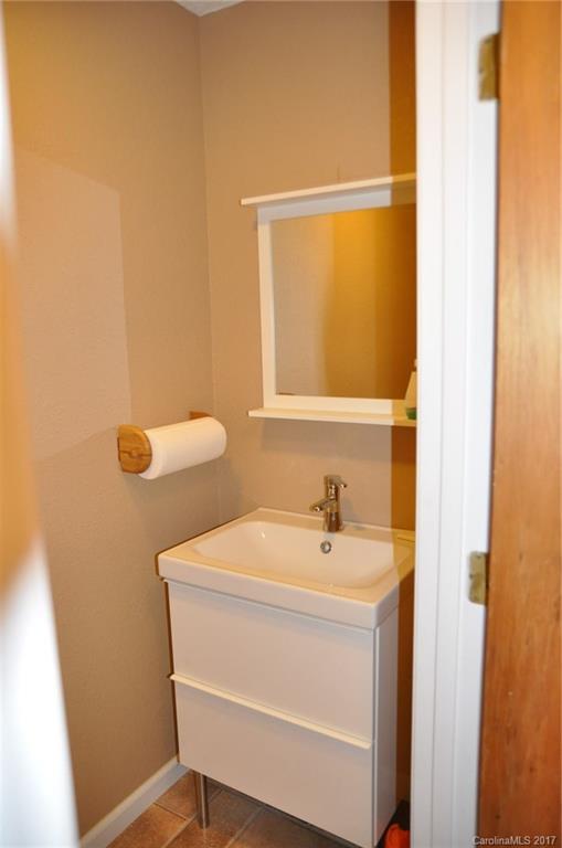 3801 White Store Road Wingate, NC 28174 - Photo 12 of 23 a bathroom with a sink a toilet and shower