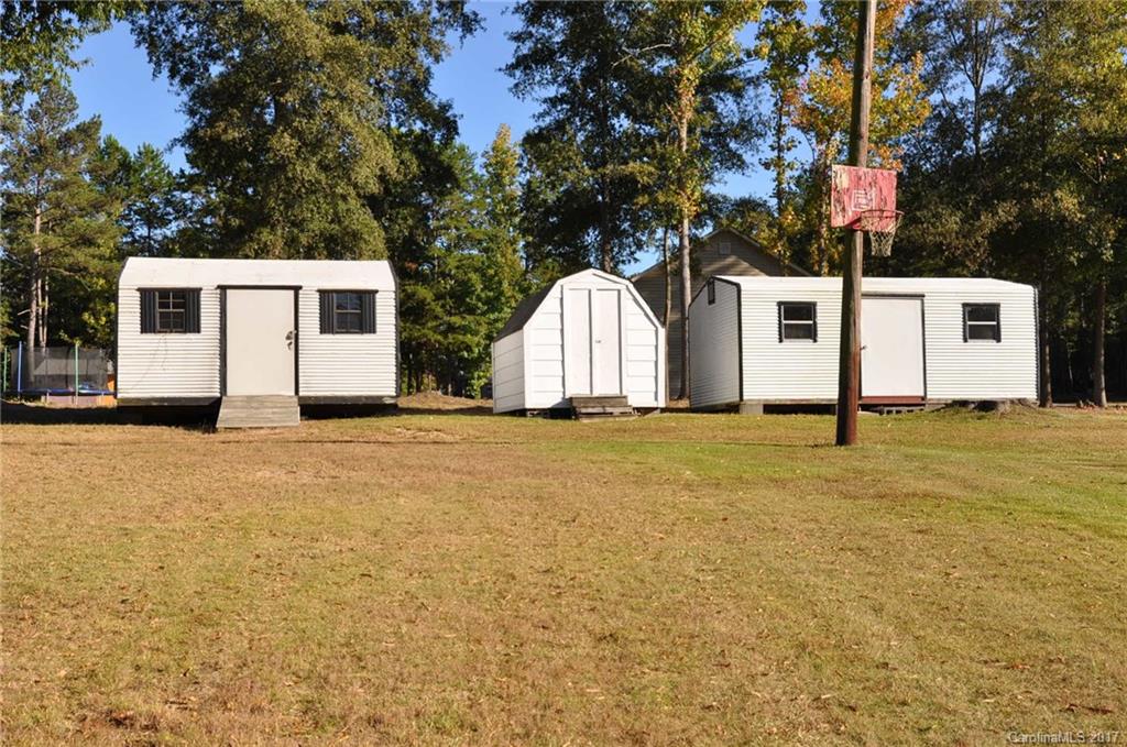 3801 White Store Road Wingate, NC 28174 - Photo 21 of 23 a view of a white house with large trees