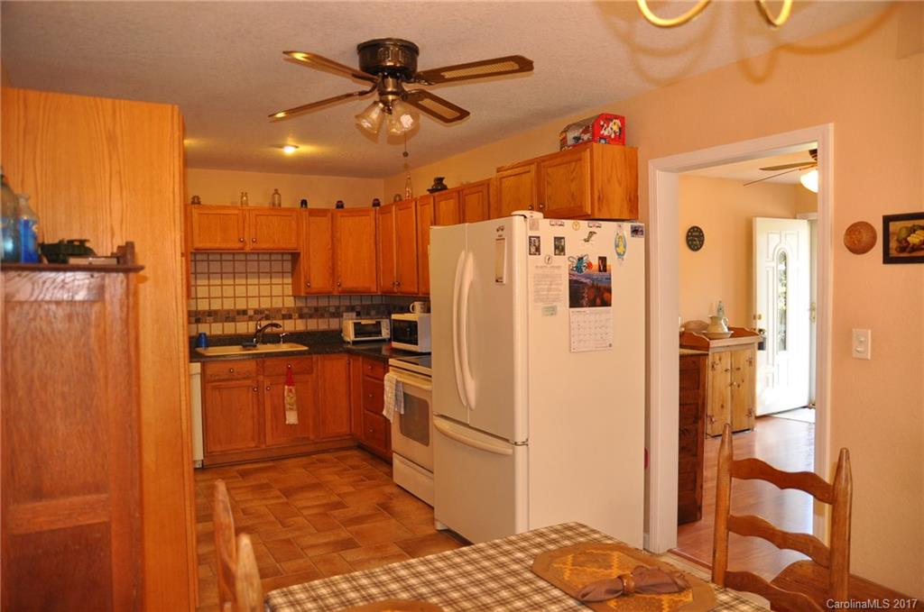 3801 White Store Road Wingate, NC 28174 - Photo 7 of 23 a kitchen with stainless steel appliances a refrigerator and a stove top oven
