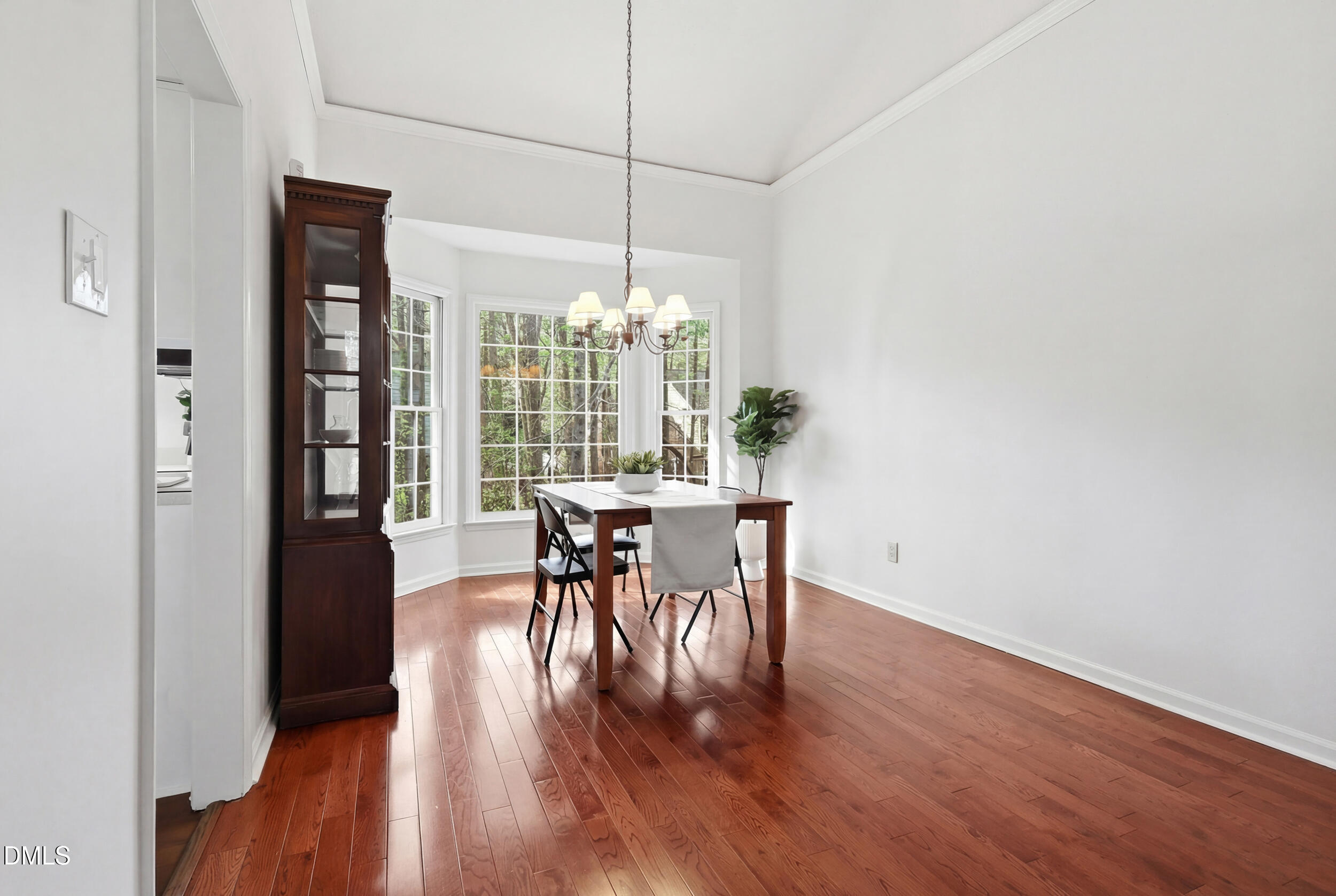 107 Canyon Run Cary, NC 27513 - Photo 10 of 43 a view of a dining room with furniture window and wooden floor
