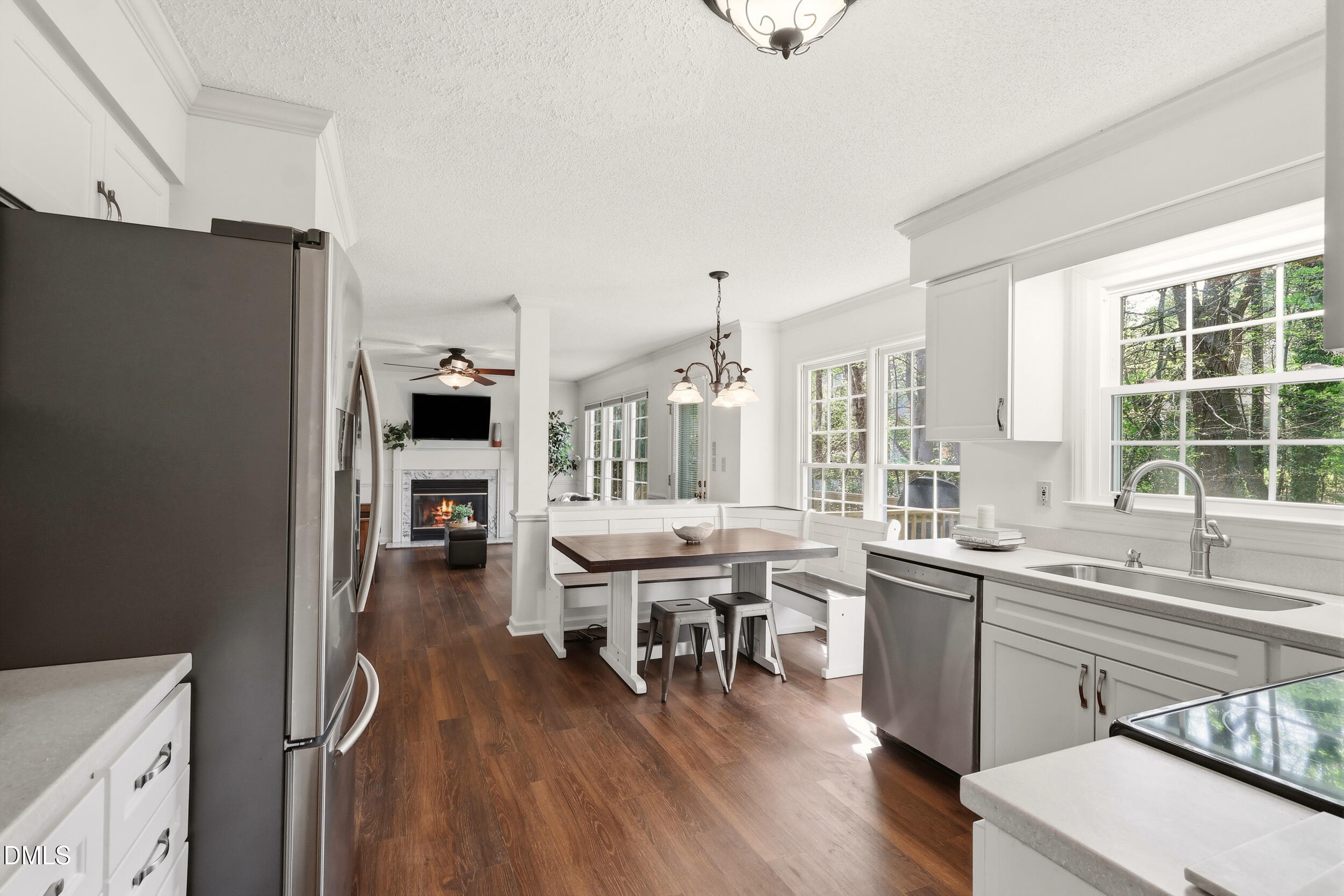 107 Canyon Run Cary, NC 27513 - Photo 15 of 43 a kitchen with lots of counter top space and painting on the wall