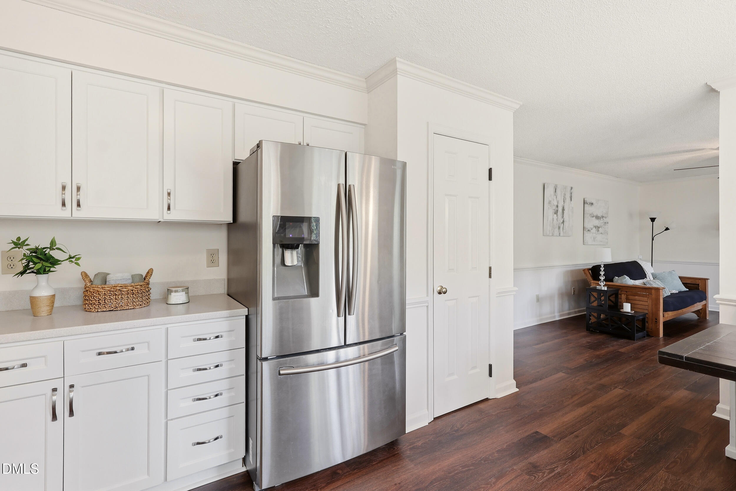107 Canyon Run Cary, NC 27513 - Photo 16 of 43 a kitchen with stainless steel appliances a refrigerator sink and cabinets