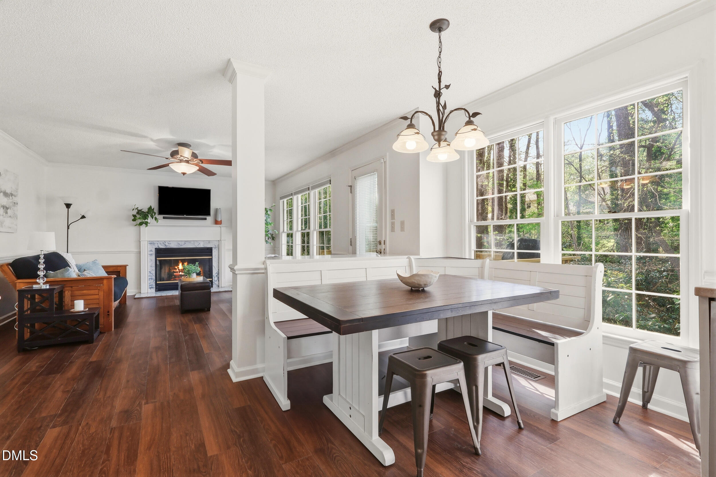 107 Canyon Run Cary, NC 27513 - Photo 17 of 43 a dining room with furniture a chandelier and wooden floor