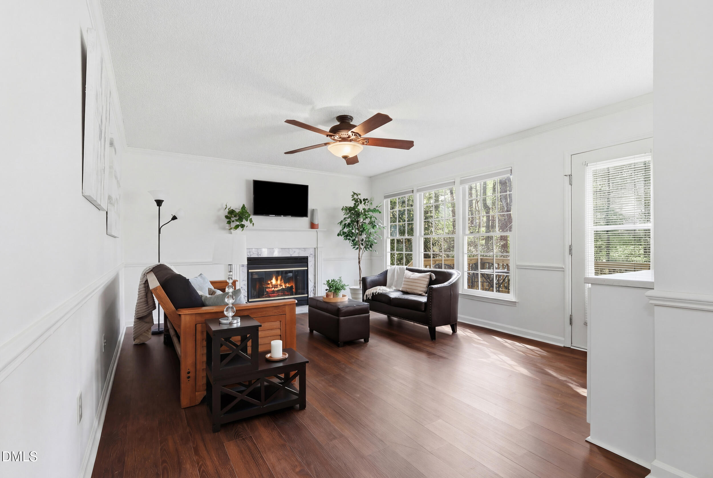 107 Canyon Run Cary, NC 27513 - Photo 18 of 43 a living room with furniture a fireplace and a flat screen tv