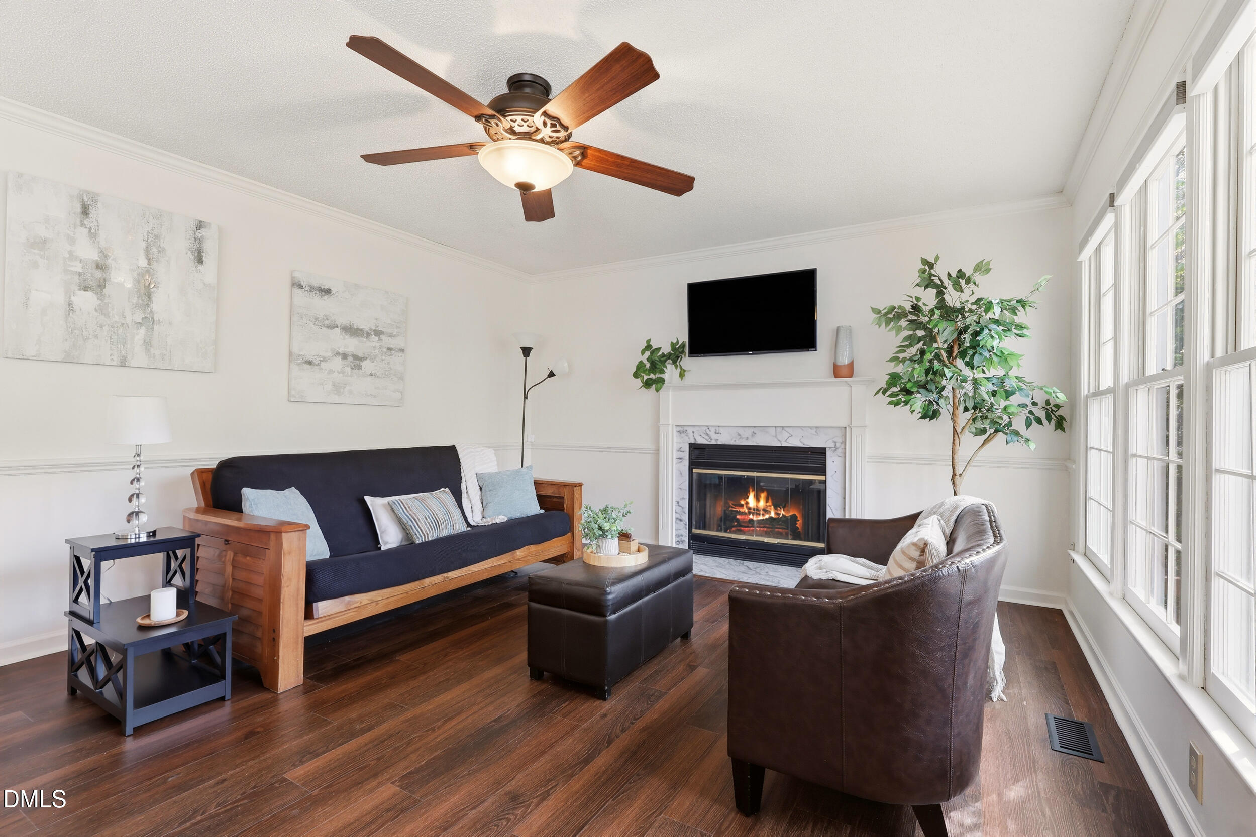 107 Canyon Run Cary, NC 27513 - Photo 19 of 43 a living room with furniture fireplace and a large window