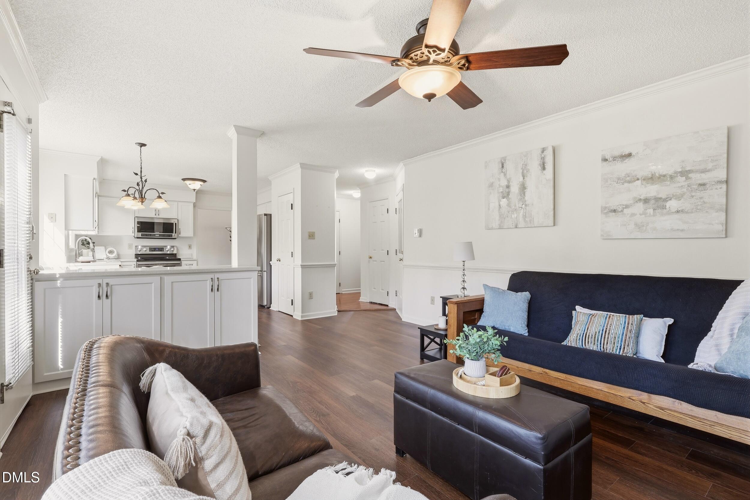 107 Canyon Run Cary, NC 27513 - Photo 21 of 43 a living room with furniture and a kitchen view
