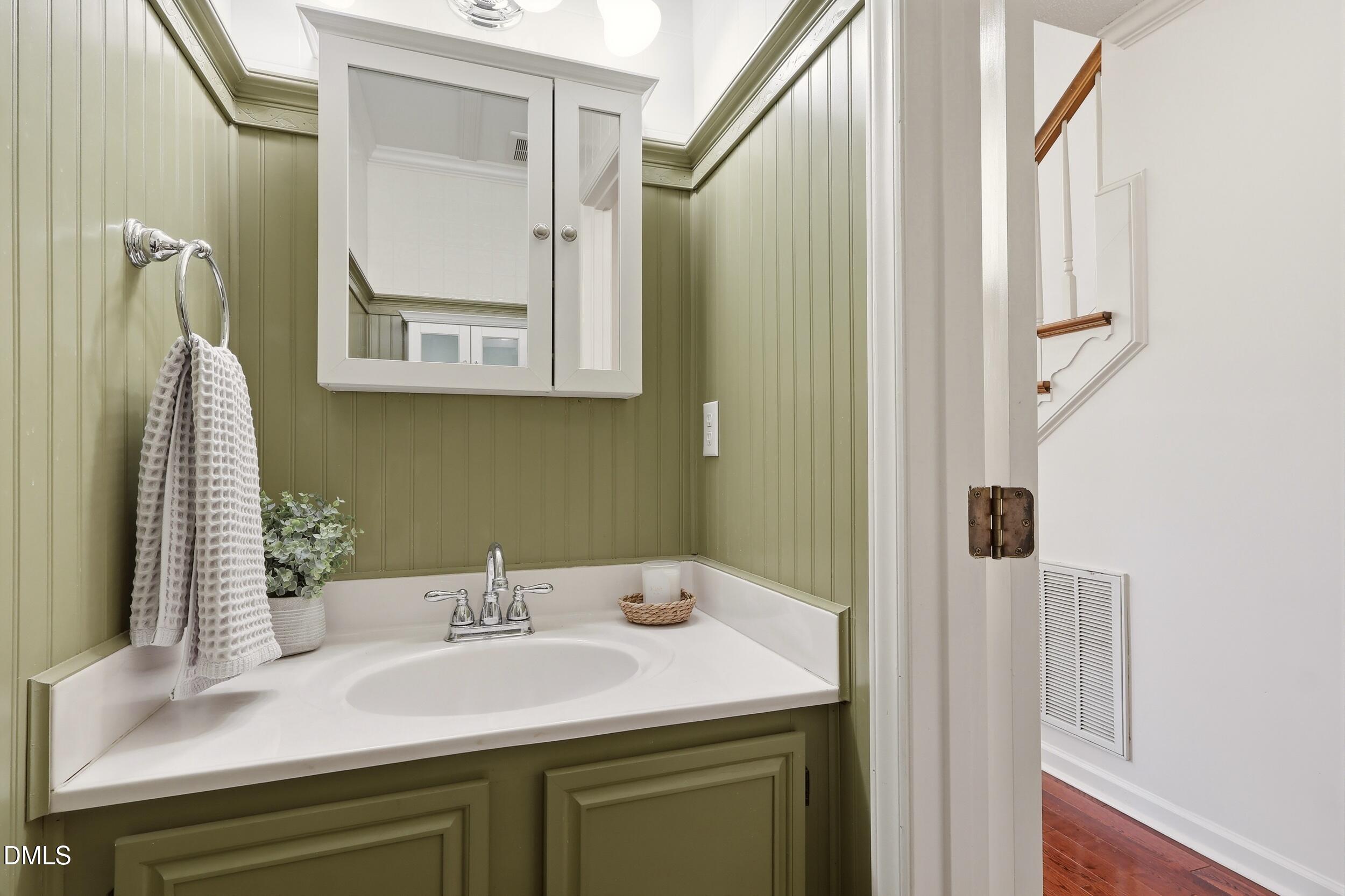 107 Canyon Run Cary, NC 27513 - Photo 23 of 43 a bathroom with a sink and a mirror