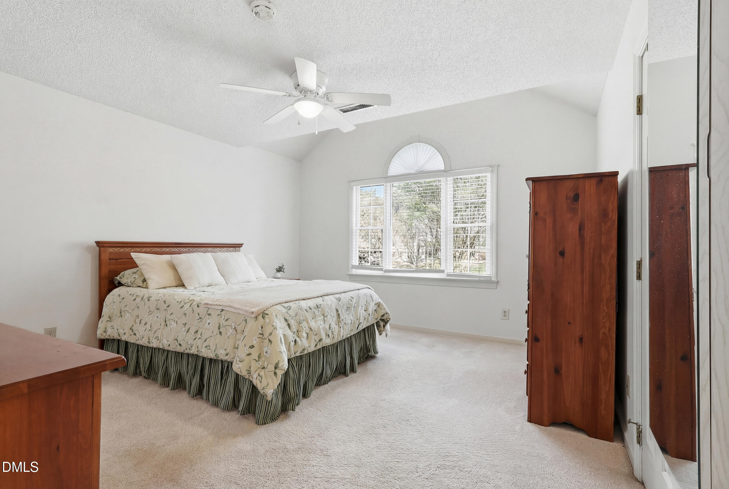 107 Canyon Run Cary, NC 27513 - Photo 26 of 43 a spacious bedroom with a bed and a window