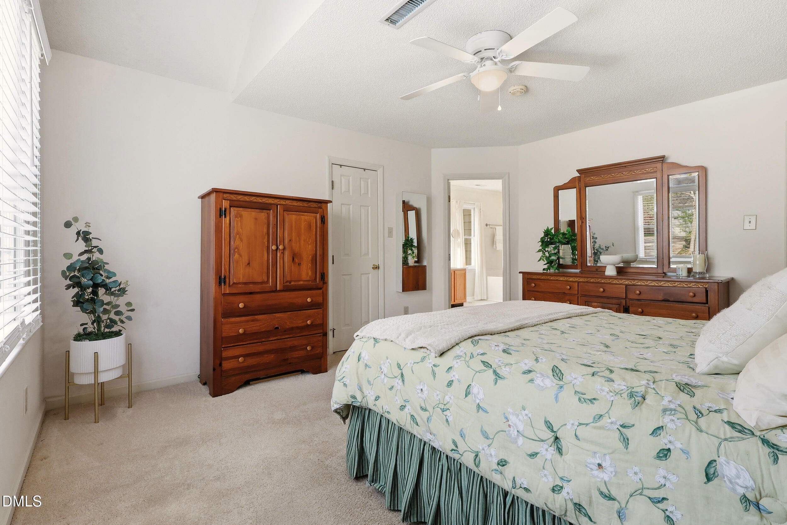 107 Canyon Run Cary, NC 27513 - Photo 27 of 43 a bedroom with a bed and a dresser