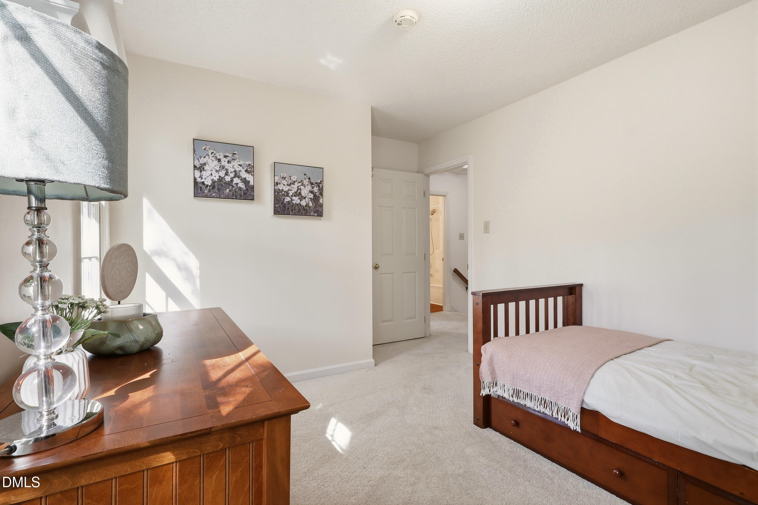 107 Canyon Run Cary, NC 27513 - Photo 33 of 43 a bedroom with a bed and a table in it