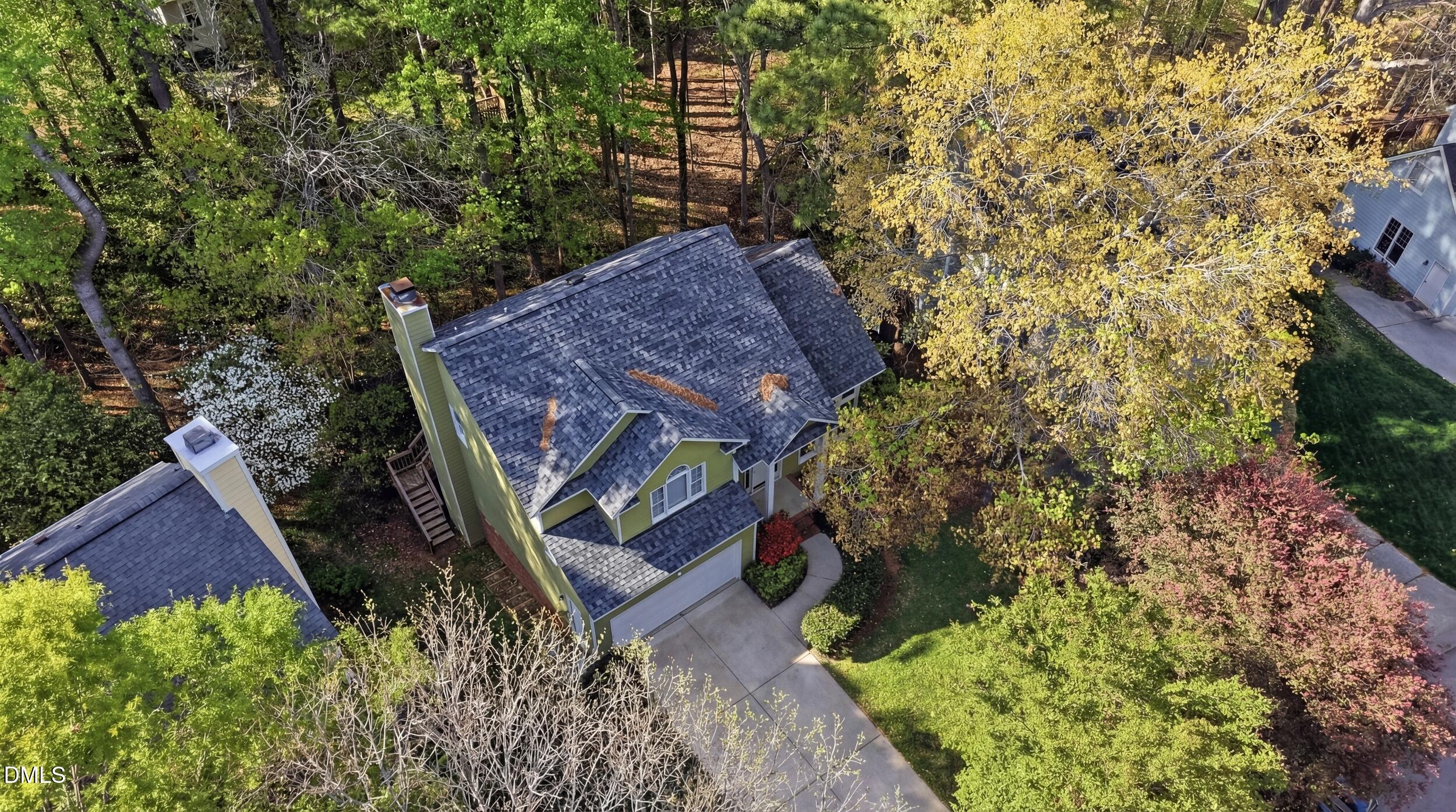 107 Canyon Run Cary, NC 27513 - Photo 3 of 43 a view of house with a yard and covered with green space