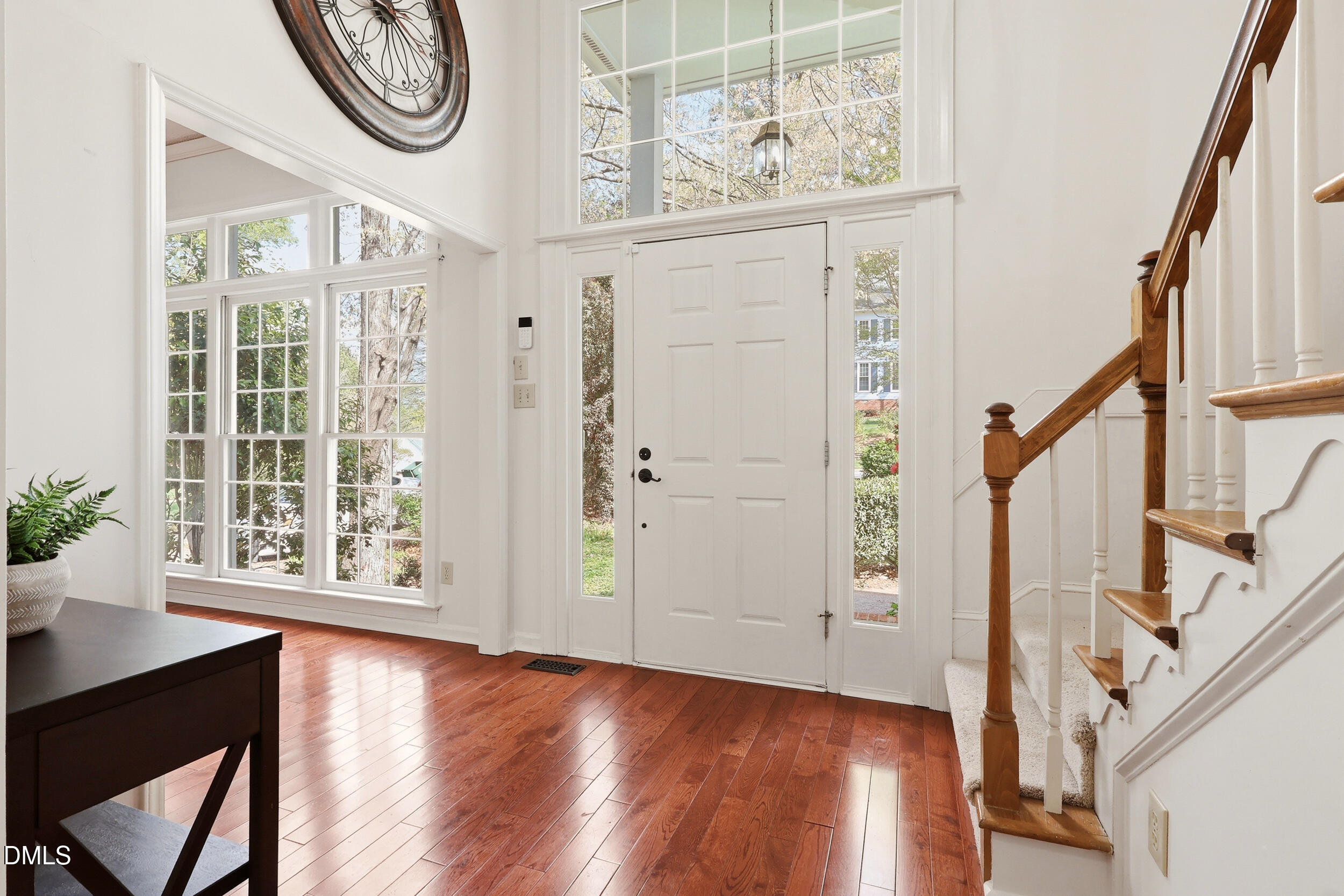 107 Canyon Run Cary, NC 27513 - Photo 4 of 43 a view of a hallway with wooden floors and a window