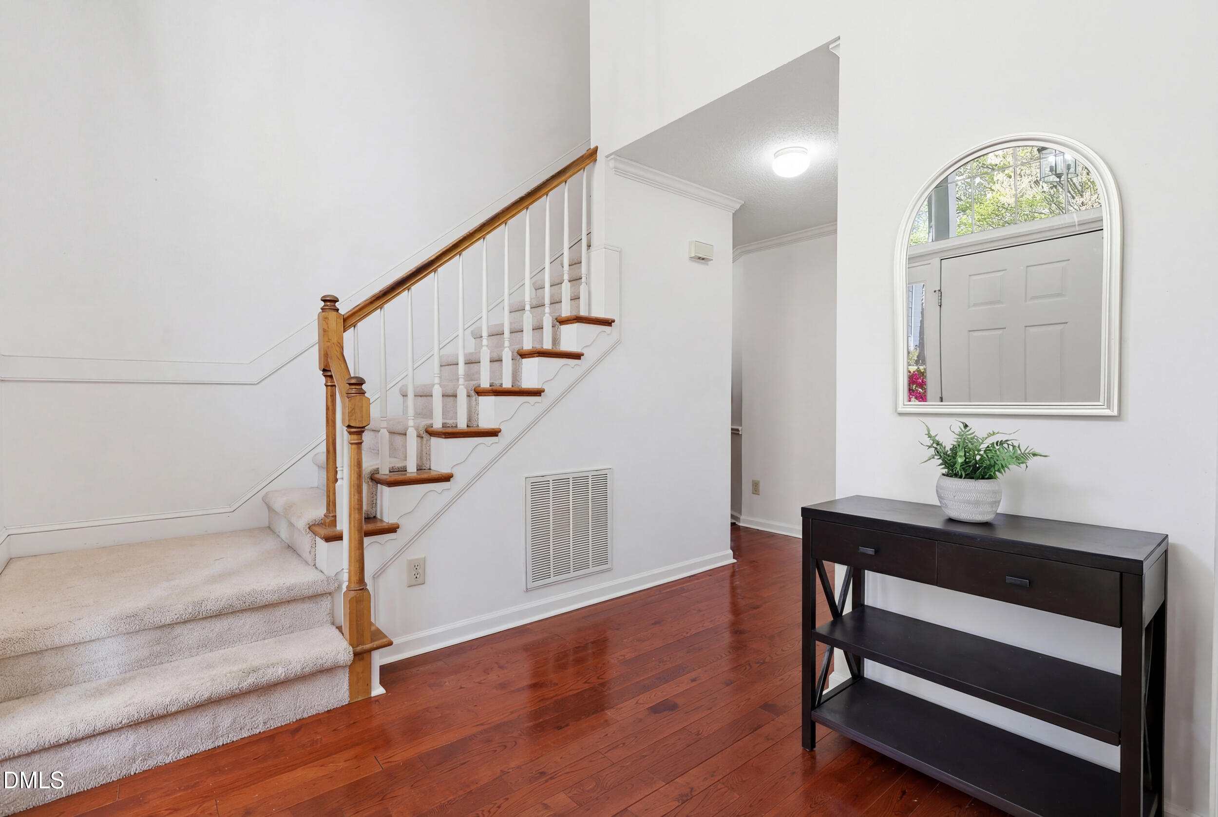 107 Canyon Run Cary, NC 27513 - Photo 5 of 43 a view of entryway and hall with wooden floor