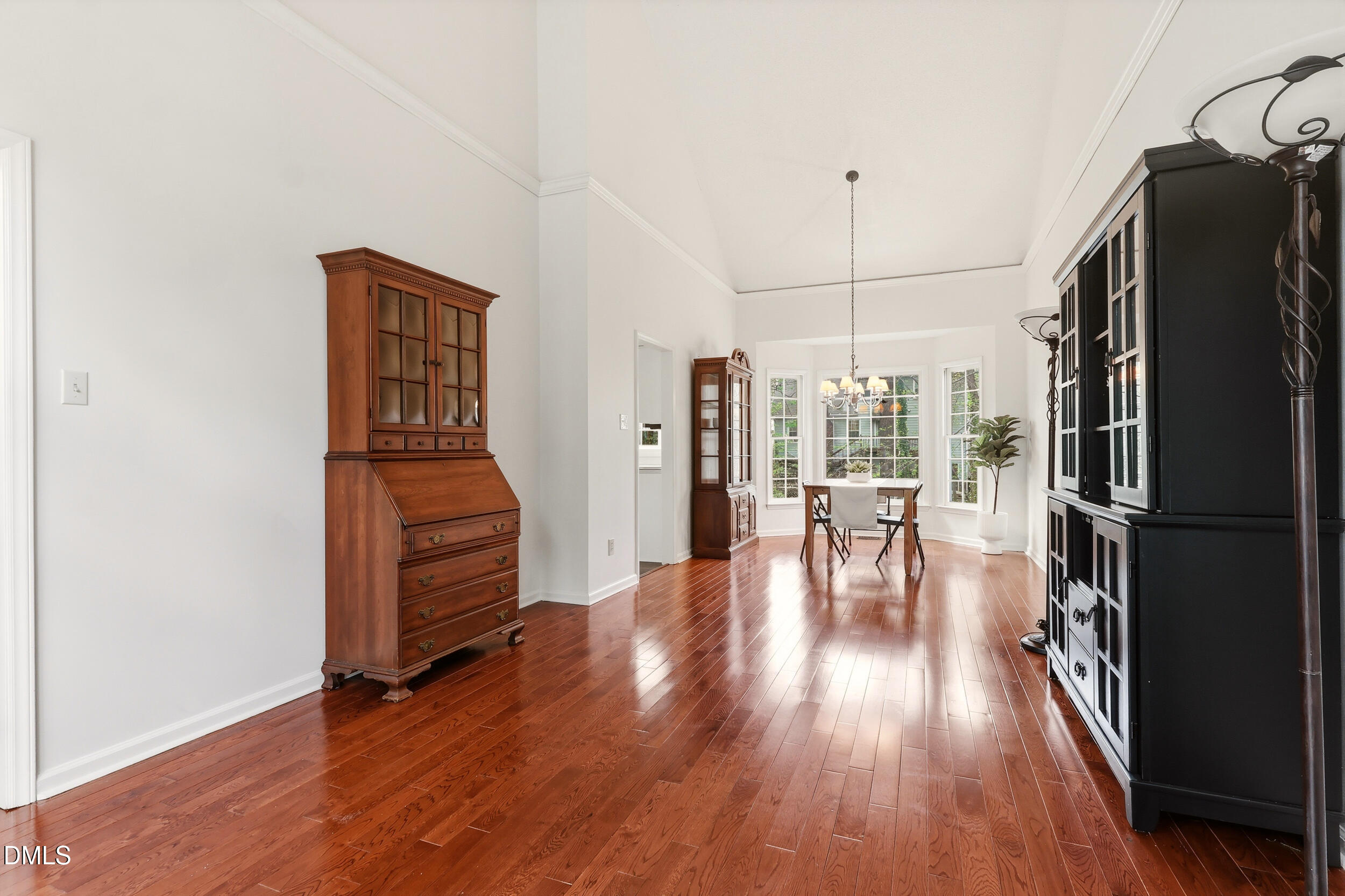 107 Canyon Run Cary, NC 27513 - Photo 9 of 43 a dining room with furniture and wooden floor