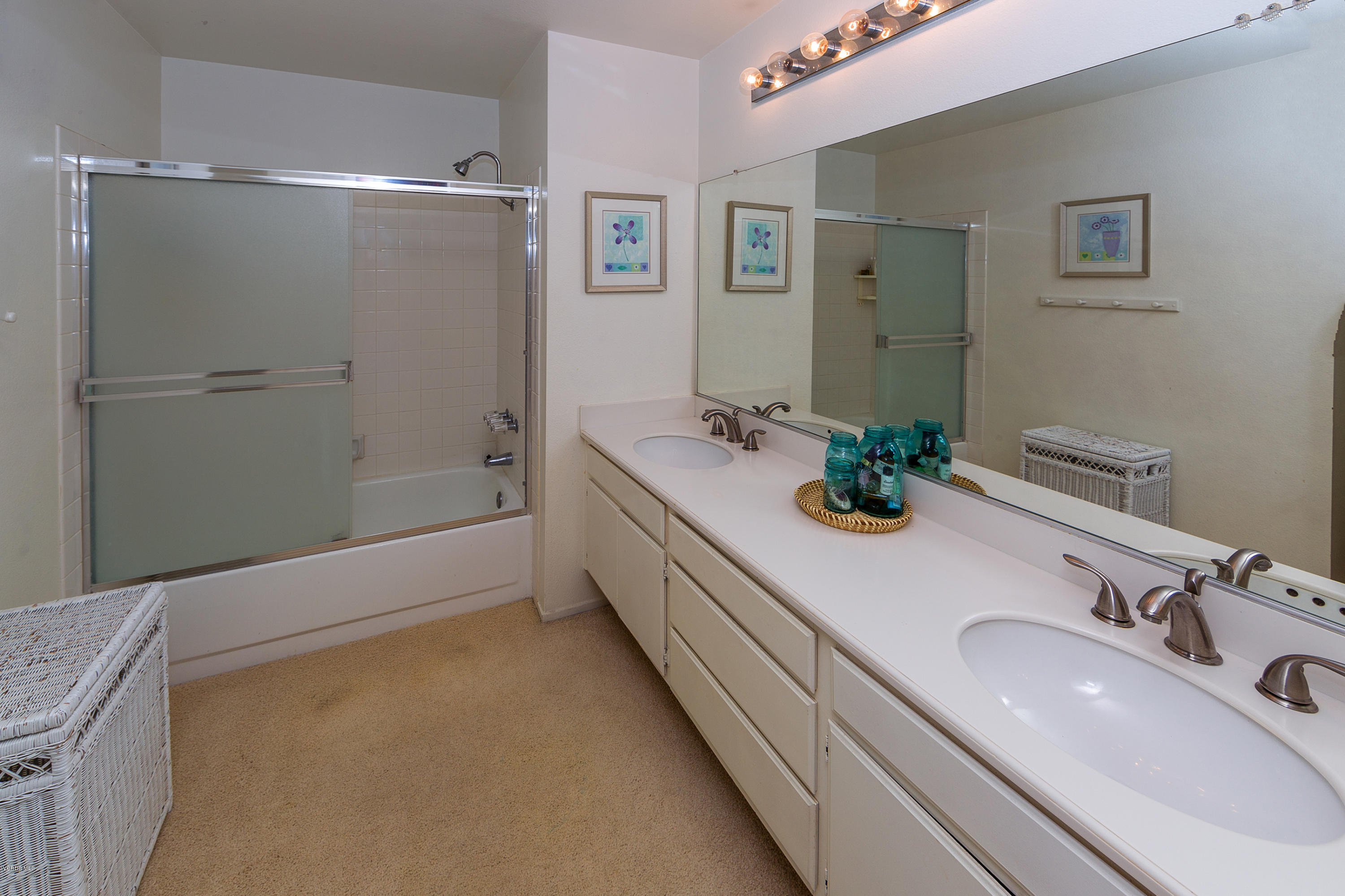 11618 Chestnut Ridge Street Moorpark, CA 93021 - Photo 22 of 33 a bathroom with a sink double vanity and a tub