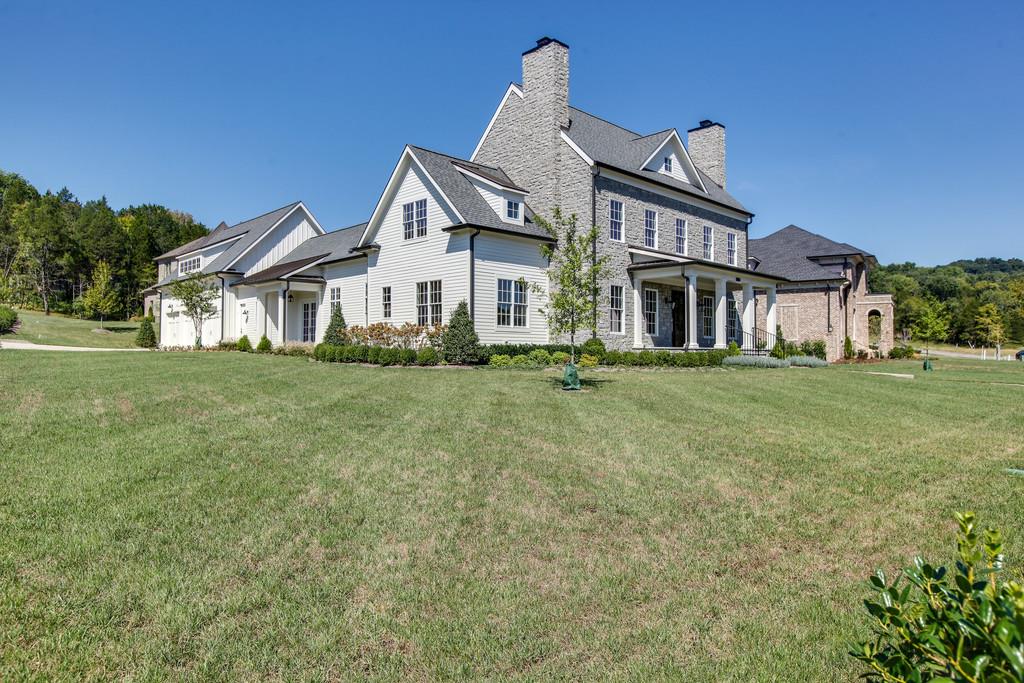 1205 Echo Lane Franklin, TN 37069 - Photo 2 of 29 a front view of a house with a yard