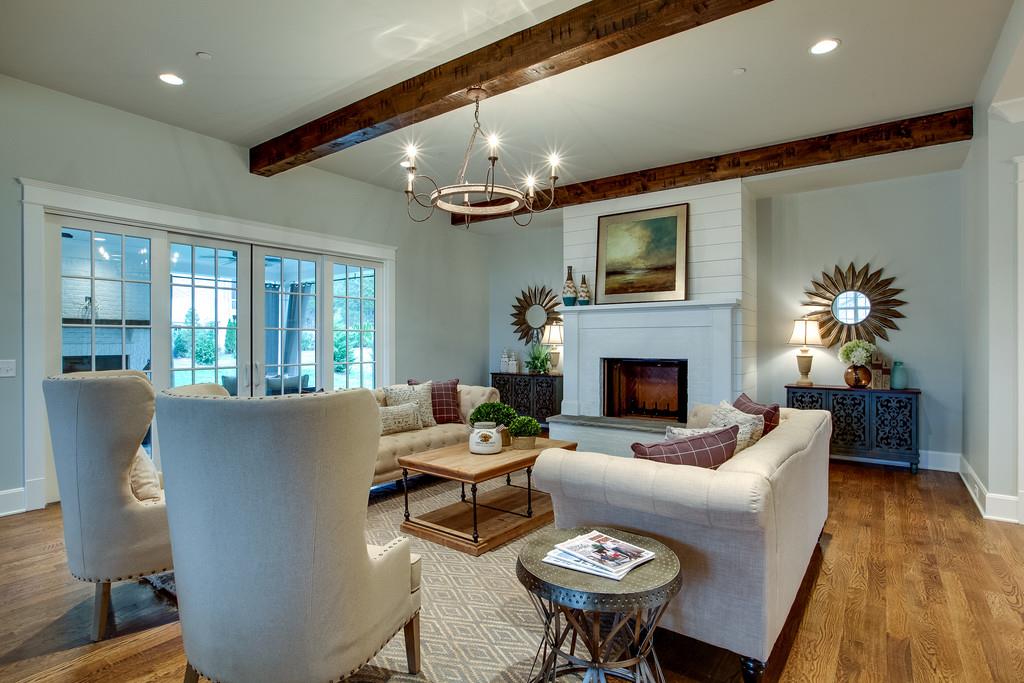 1205 Echo Lane Franklin, TN 37069 - Photo 11 of 29 a living room with furniture a fireplace and a flat screen tv