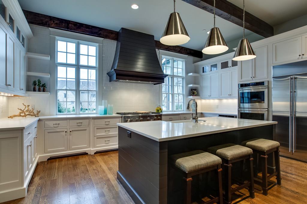 1205 Echo Lane Franklin, TN 37069 - Photo 15 of 29 a kitchen with stainless steel appliances granite countertop a sink a stove and a refrigerator