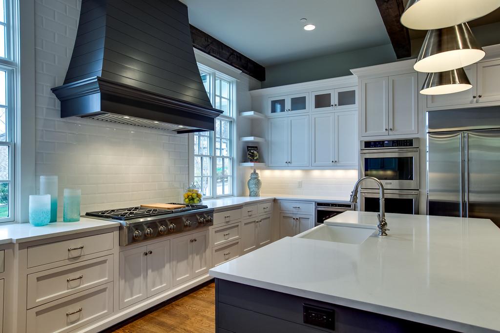 1205 Echo Lane Franklin, TN 37069 - Photo 16 of 29 a kitchen with stainless steel appliances a sink a stove and cabinets