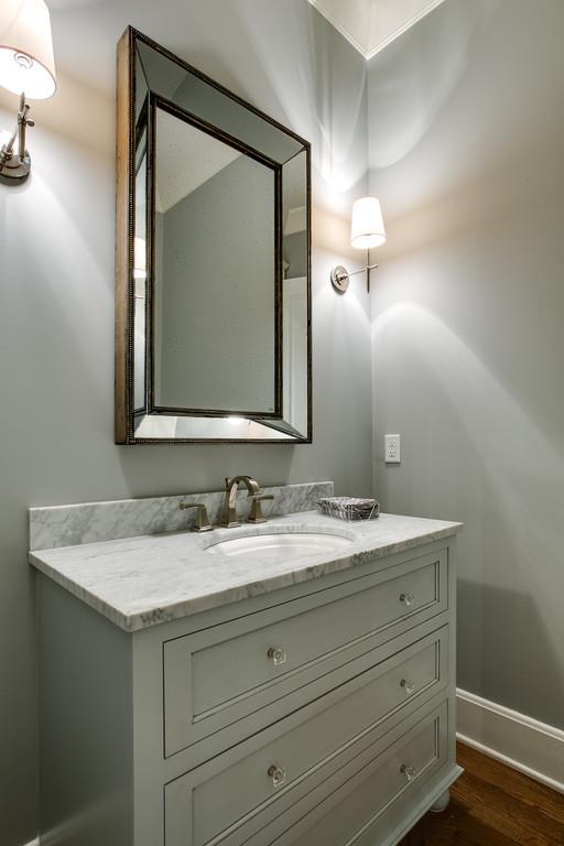 1205 Echo Lane Franklin, TN 37069 - Photo 19 of 29 a bathroom with a granite countertop sink vanity and a mirror