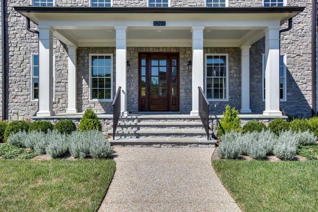 1205 Echo Lane Franklin, TN 37069 - Photo 3 of 29 front view of a house with a yard