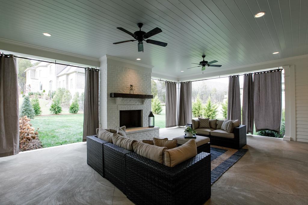 1205 Echo Lane Franklin, TN 37069 - Photo 27 of 29 a living room with furniture fireplace and a large window