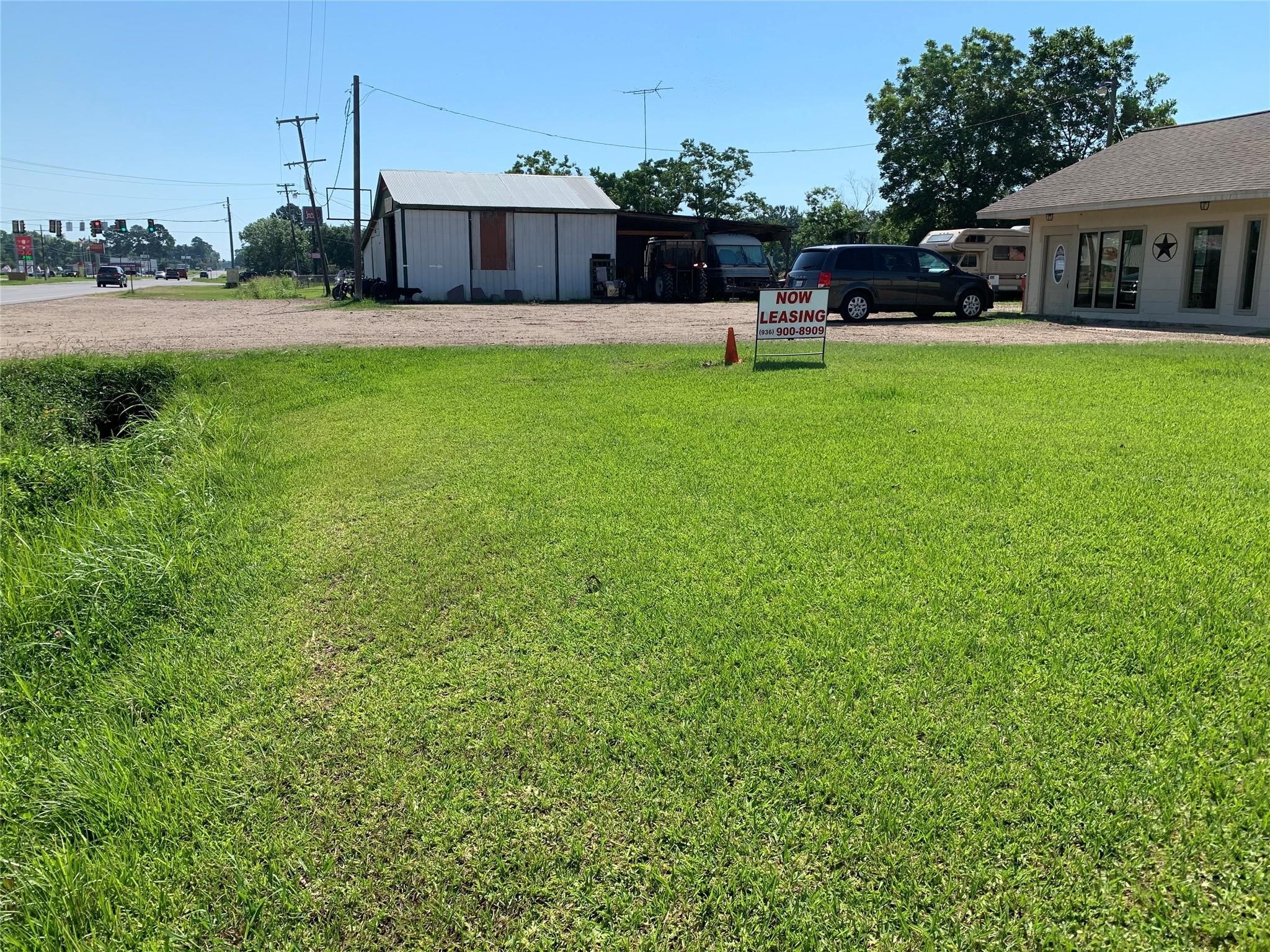 2214 North Main Street Liberty, TX 77575 - Photo 2 of 5 a view of a house with backyard sitting area and garden