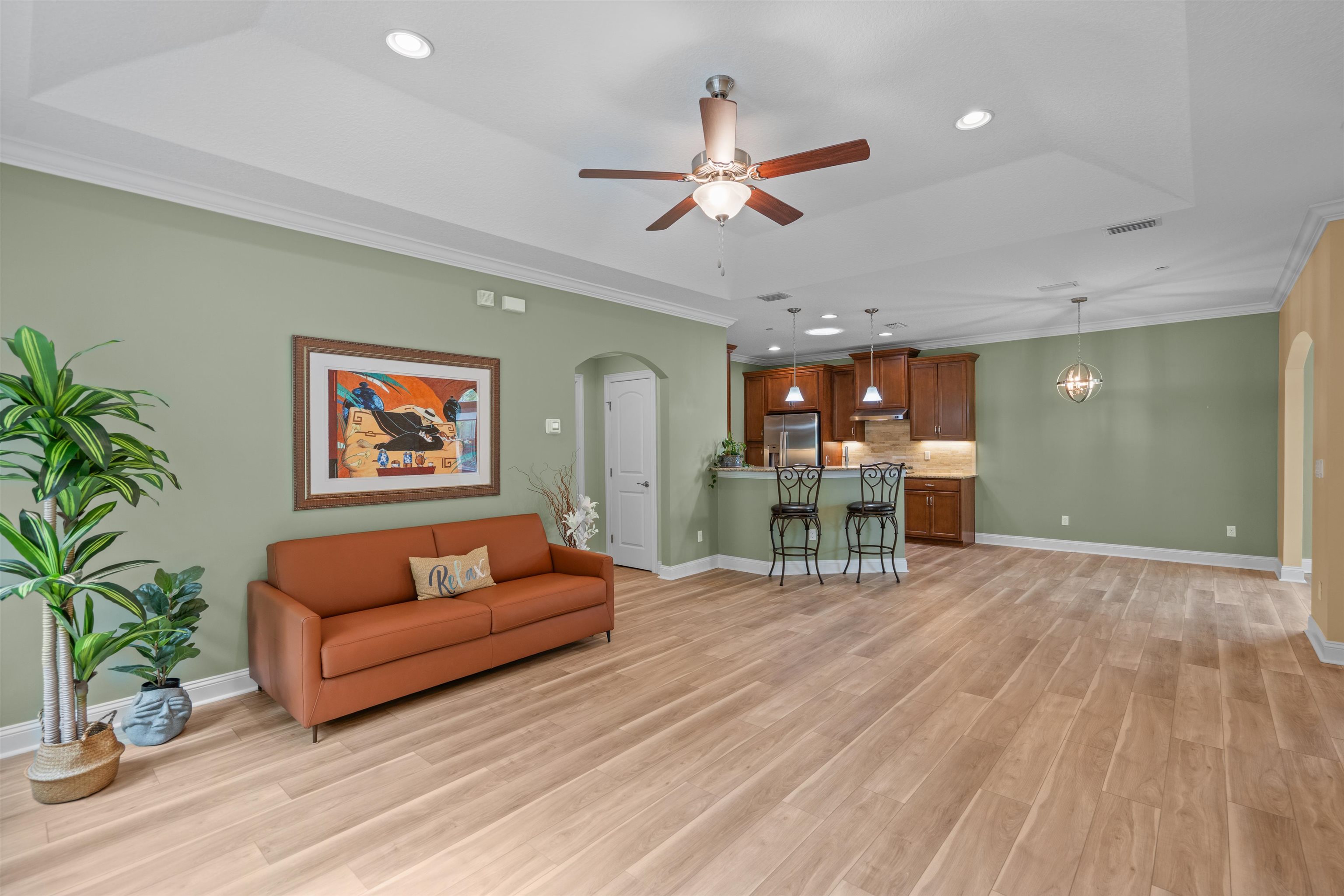 148 Timoga Trail St. Augustine, FL 32084 - Photo 11 of 46 a living room with furniture and a wooden floor