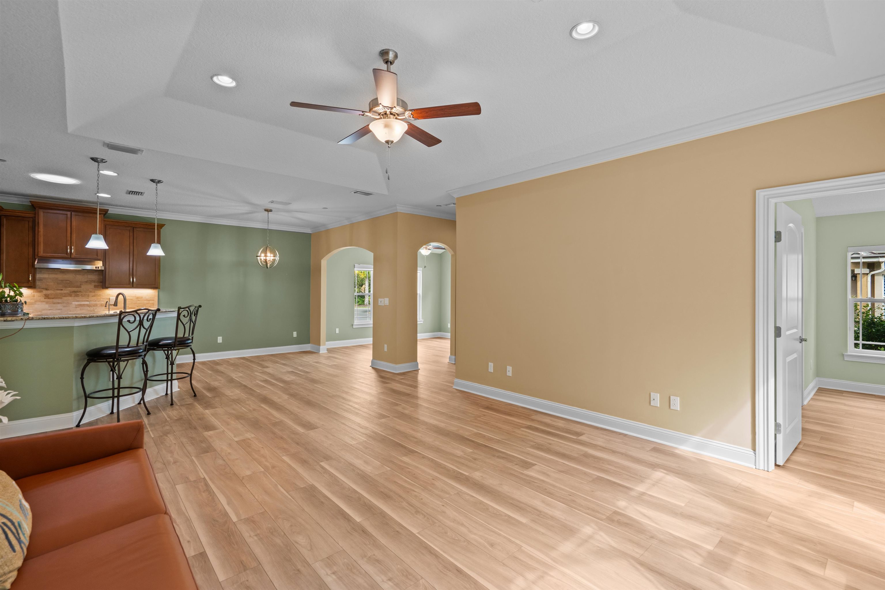 148 Timoga Trail St. Augustine, FL 32084 - Photo 12 of 46 a view of a livingroom with furniture and a ceiling fan