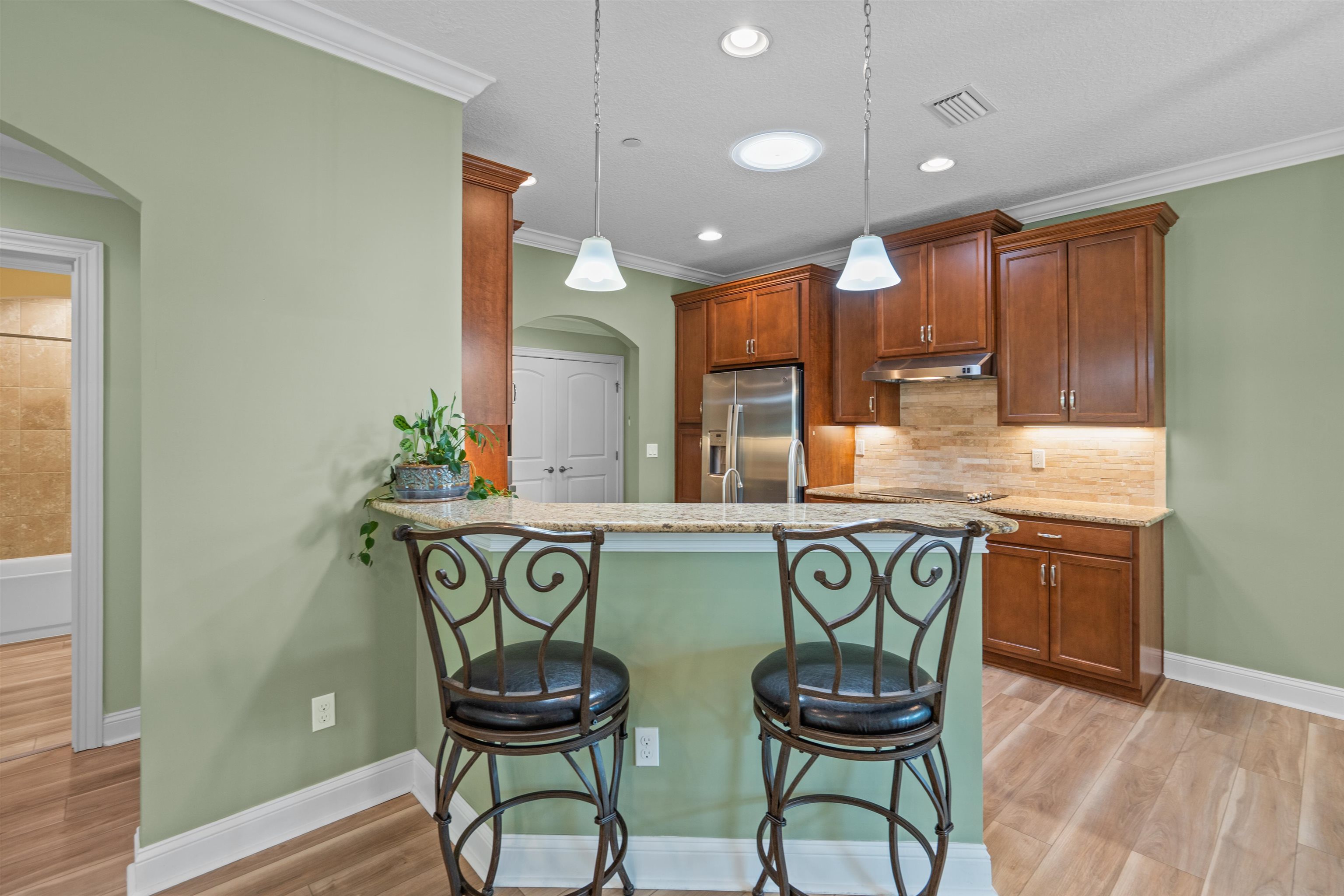 148 Timoga Trail St. Augustine, FL 32084 - Photo 13 of 46 a kitchen with stainless steel appliances granite countertop a sink and a window