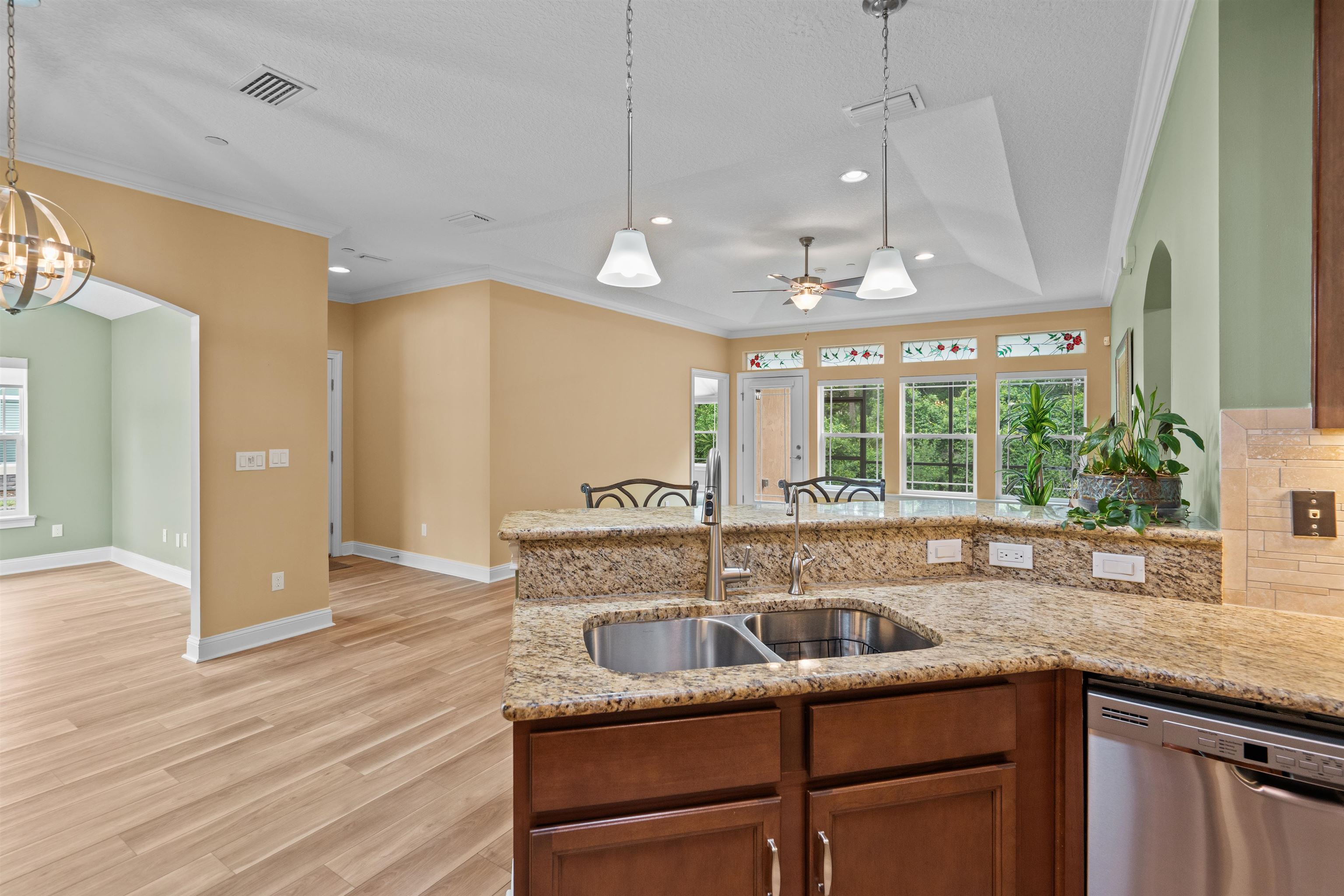 148 Timoga Trail St. Augustine, FL 32084 - Photo 18 of 46 a kitchen with stainless steel appliances granite countertop a sink a counter space and a window