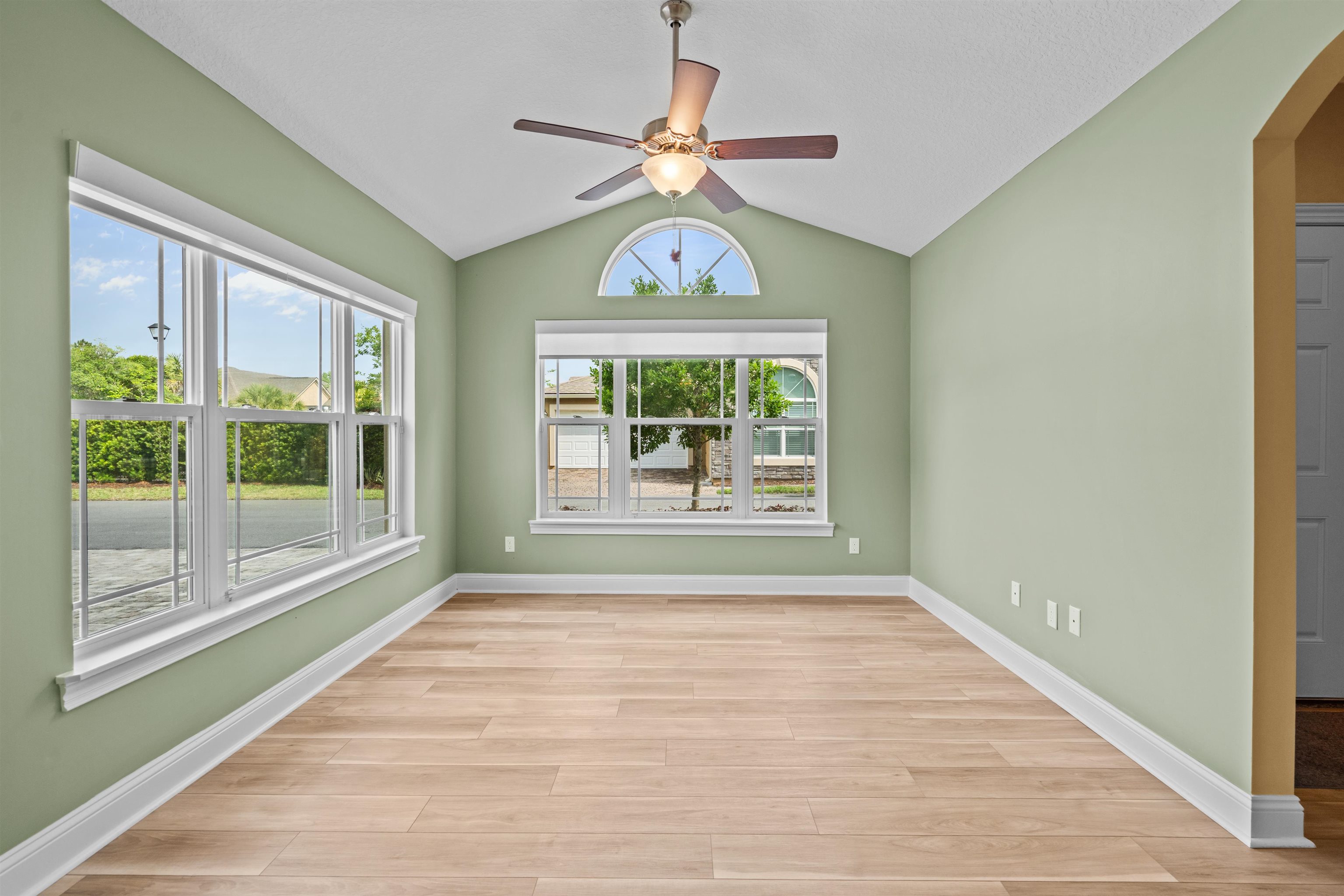 148 Timoga Trail St. Augustine, FL 32084 - Photo 22 of 46 a view of an empty room with wooden floor and a window
