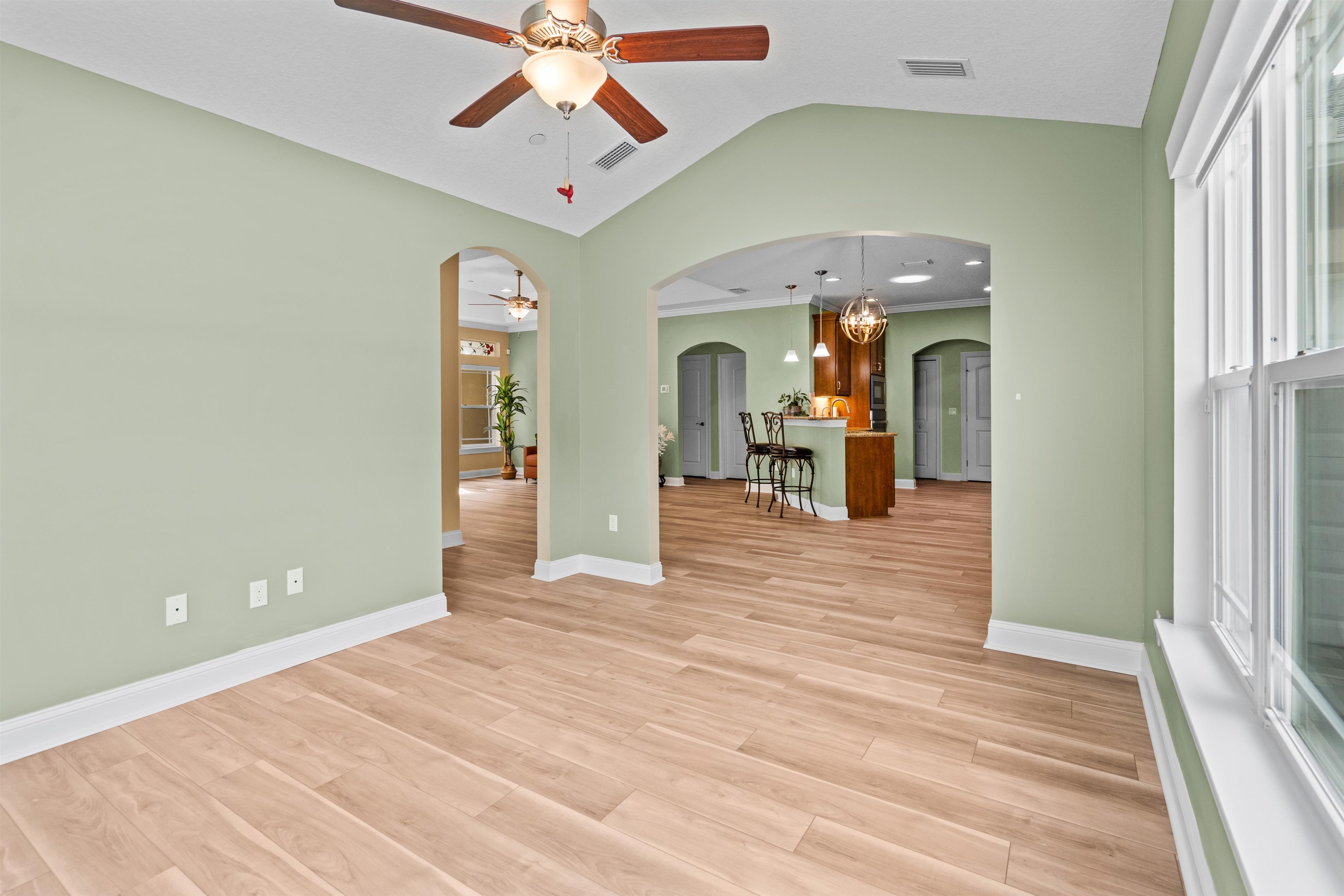 148 Timoga Trail St. Augustine, FL 32084 - Photo 23 of 46 wooden floor in an empty room with a window