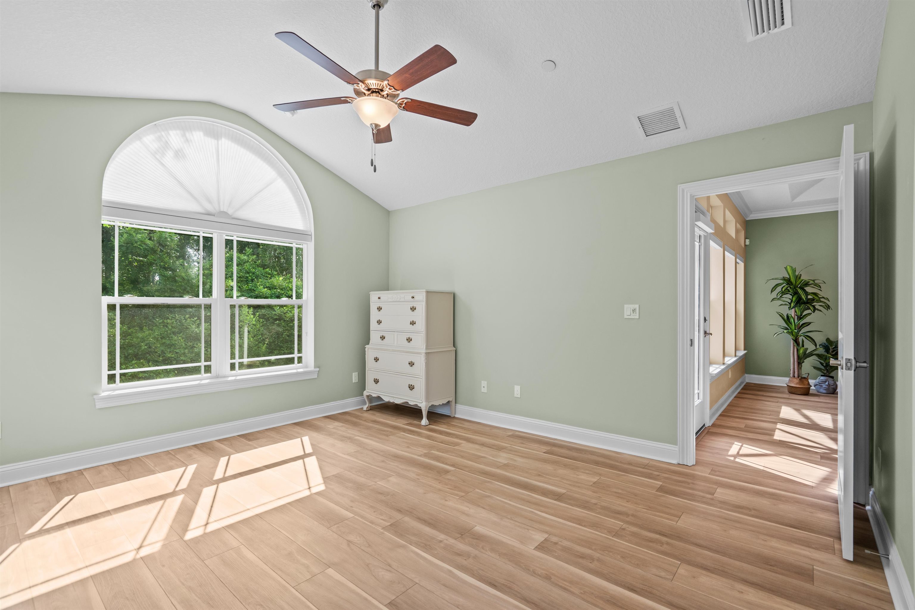 148 Timoga Trail St. Augustine, FL 32084 - Photo 25 of 46 wooden floor in an empty room with a window