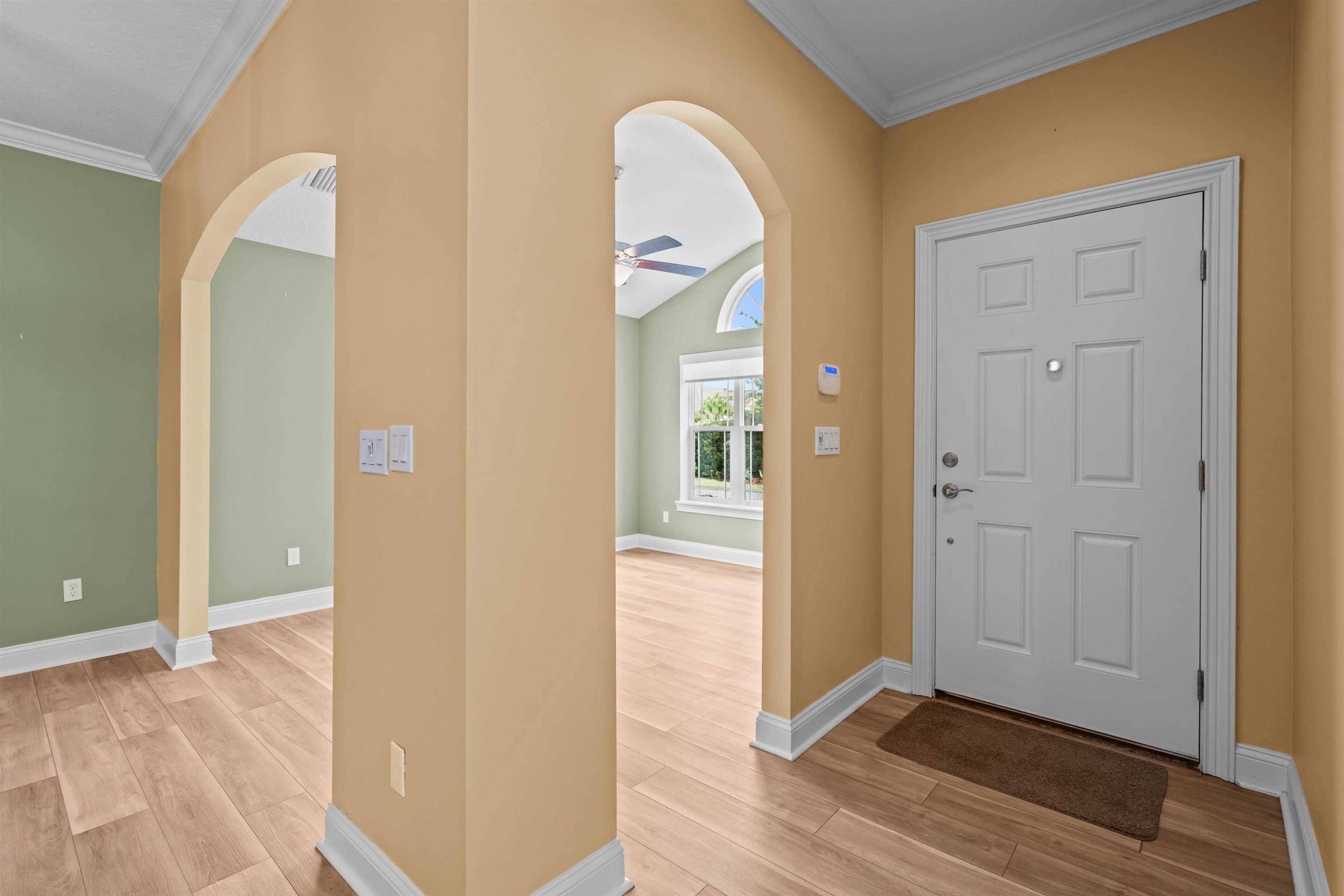 148 Timoga Trail St. Augustine, FL 32084 - Photo 3 of 46 an empty room with wooden floor and mirror