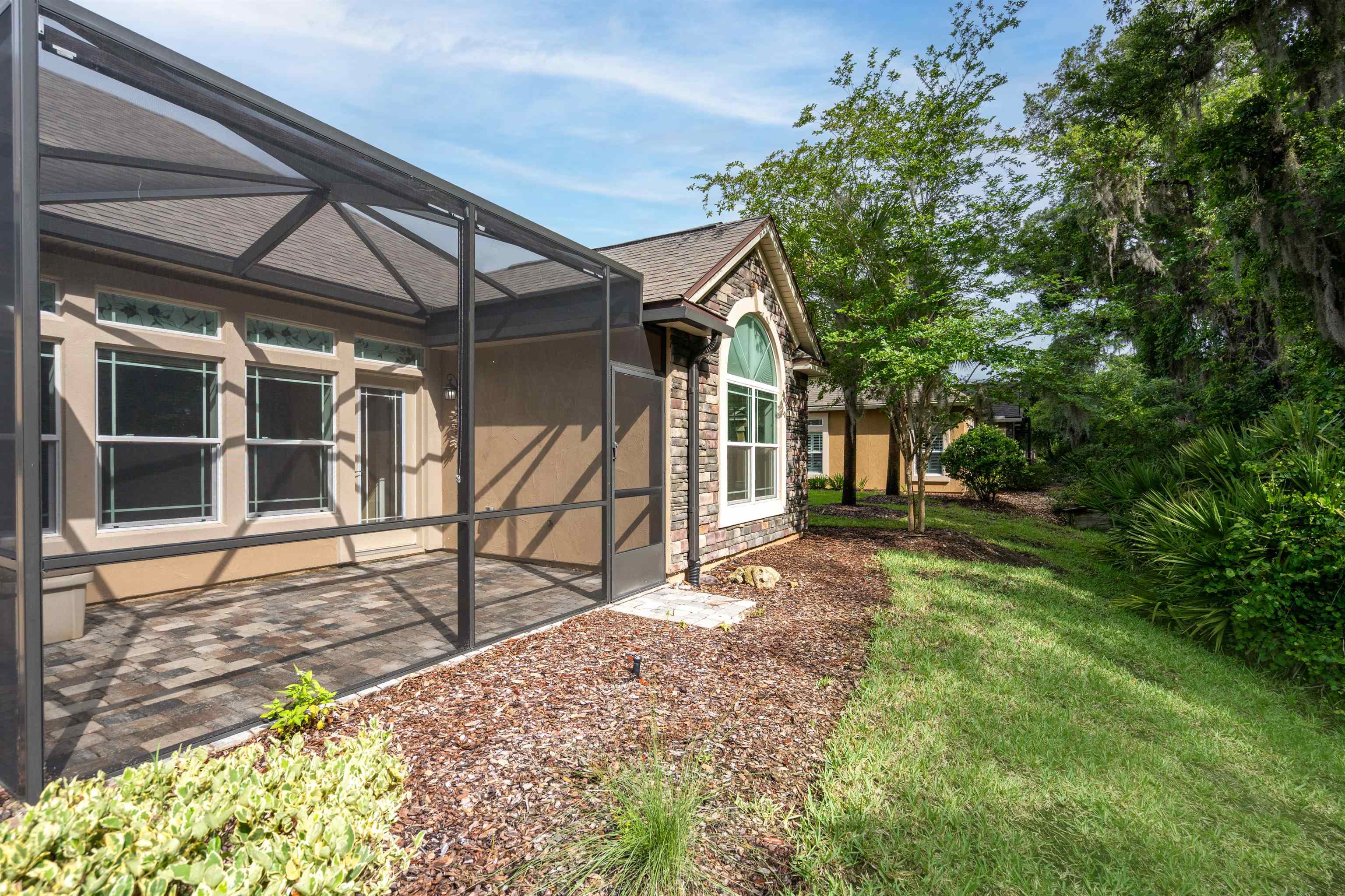 148 Timoga Trail St. Augustine, FL 32084 - Photo 9 of 46 a house with trees in front of it