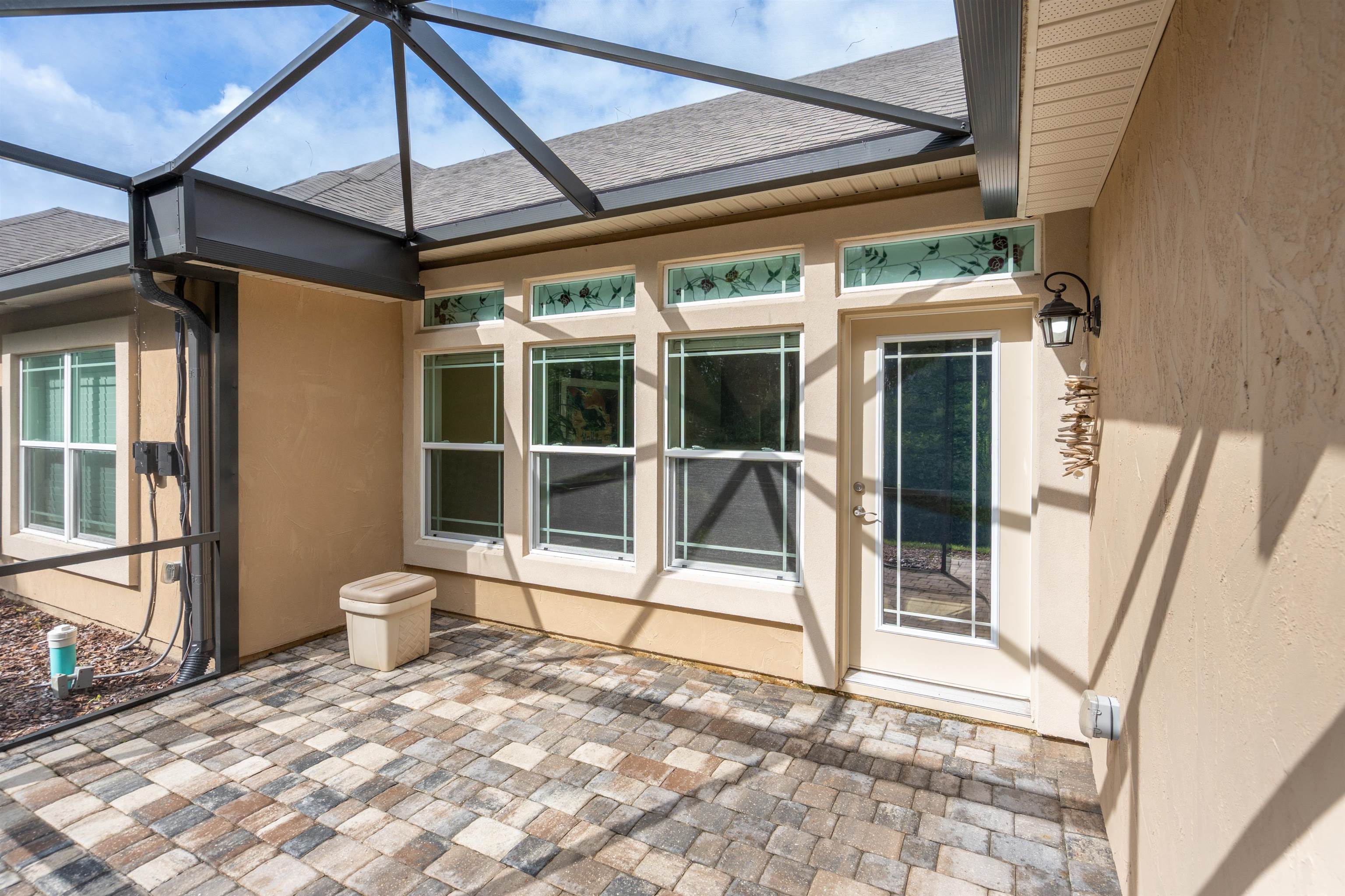 148 Timoga Trail St. Augustine, FL 32084 - Photo 10 of 46 a view of a porch with a table and chairs