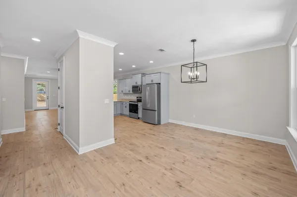 a view of a kitchen and a chandelier