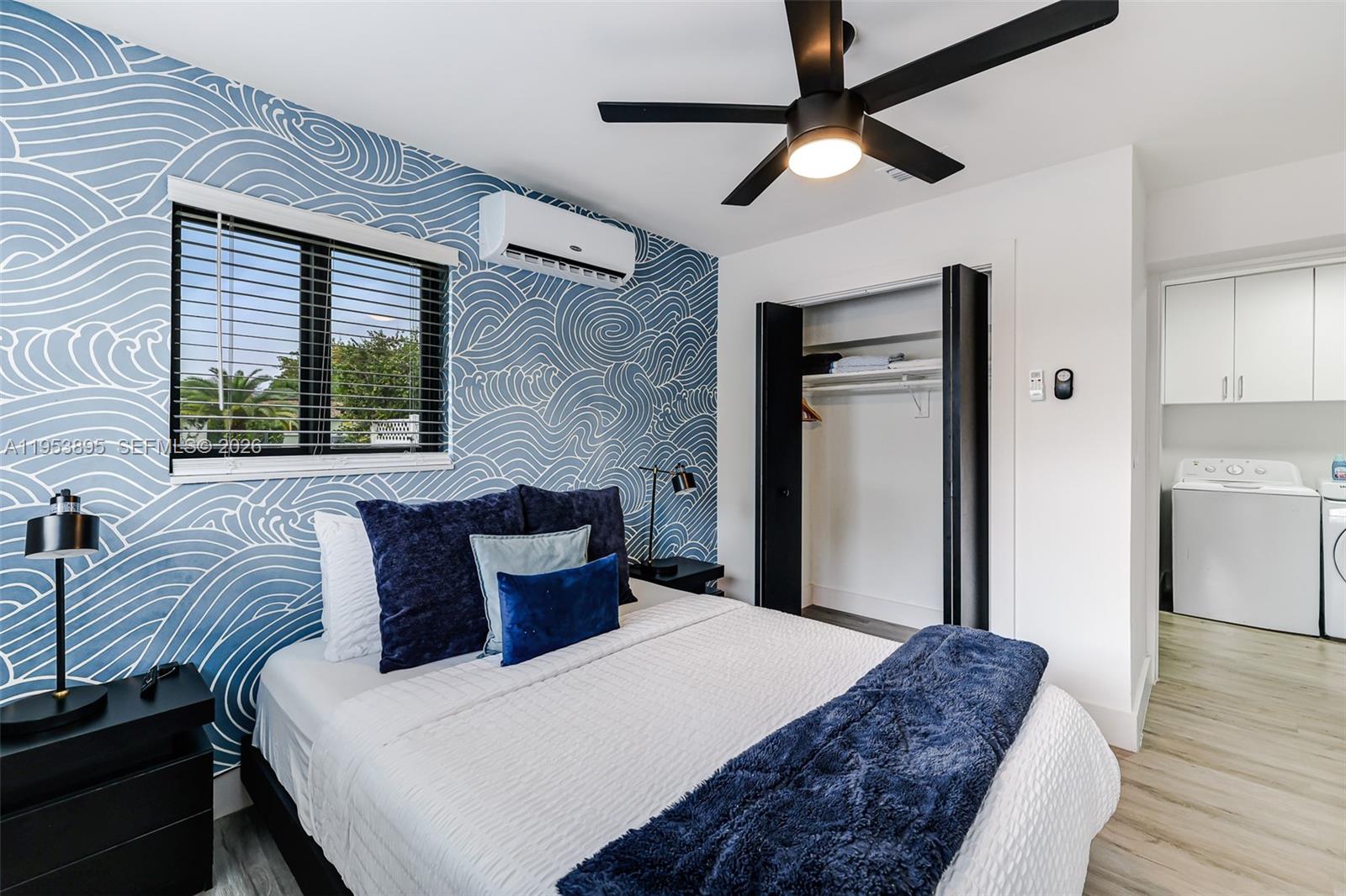 10870 Southwest 106th Avenue Miami, FL 33176 - Photo 11 of 48 a bedroom with a bed and a chandelier