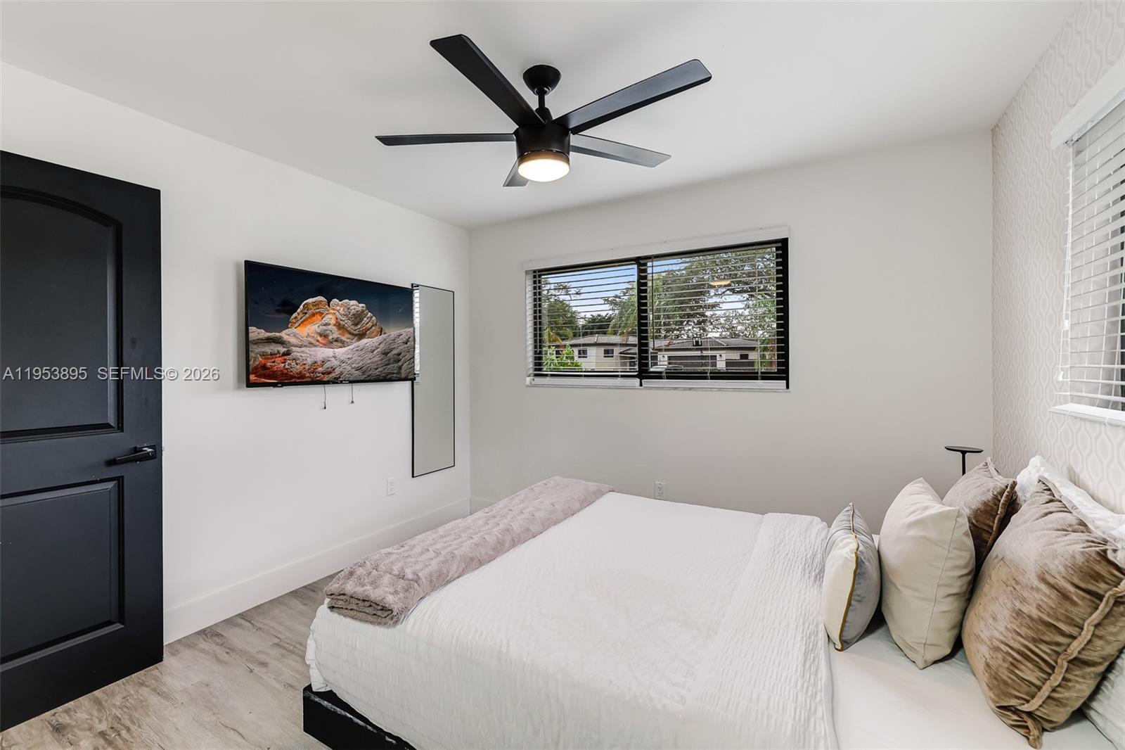 10870 Southwest 106th Avenue Miami, FL 33176 - Photo 15 of 48 a bedroom with a bed and a large mirror