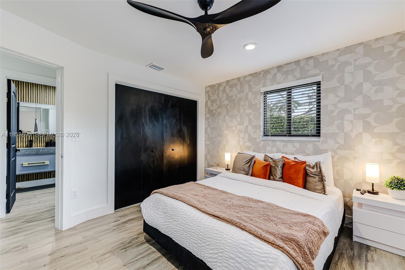 10870 Southwest 106th Avenue Miami, FL 33176 - Photo 25 of 48 a bedroom with a bed and wooden floor