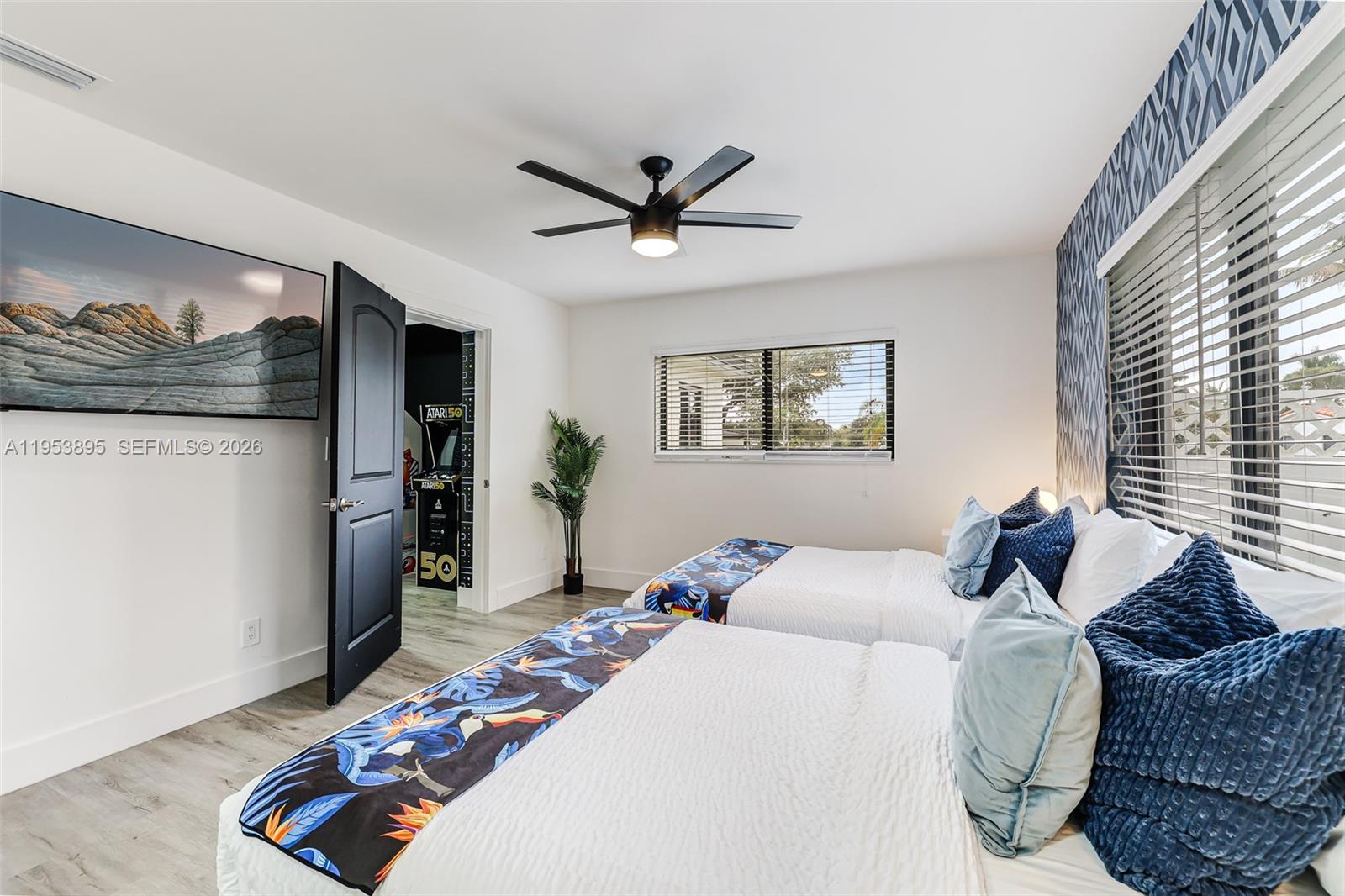 10870 Southwest 106th Avenue Miami, FL 33176 - Photo 33 of 48 a bedroom with a bed and glass walk in closet