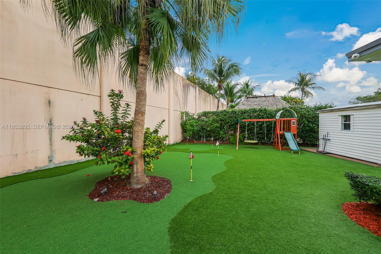 10870 Southwest 106th Avenue Miami, FL 33176 - Photo 37 of 48 a view of a backyard with potted plants and palm trees