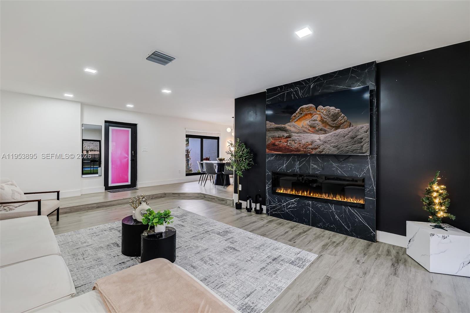 10870 Southwest 106th Avenue Miami, FL 33176 - Photo 5 of 48 a living room with furniture and a flat screen tv