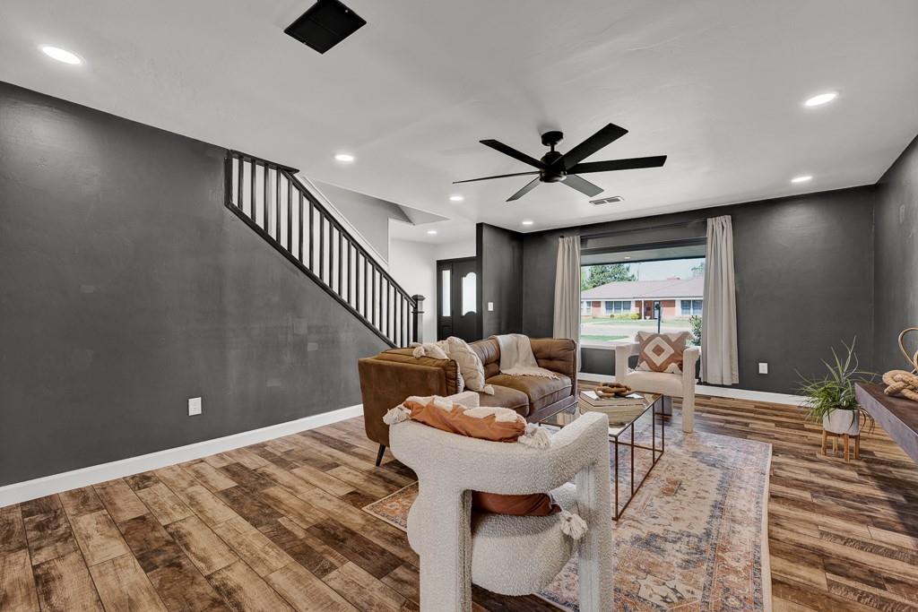 6117 Gainsborough Road Amarillo, TX 79106 - Photo 4 of 40 a living room with furniture and a ceiling fan