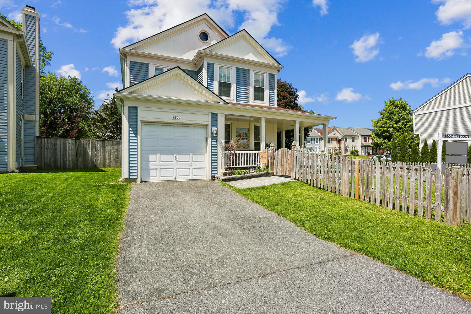 14822 Rose Trellis Place Silver Spring, MD 20906 - Photo 52 of 65 a front view of a house with a yard and garage