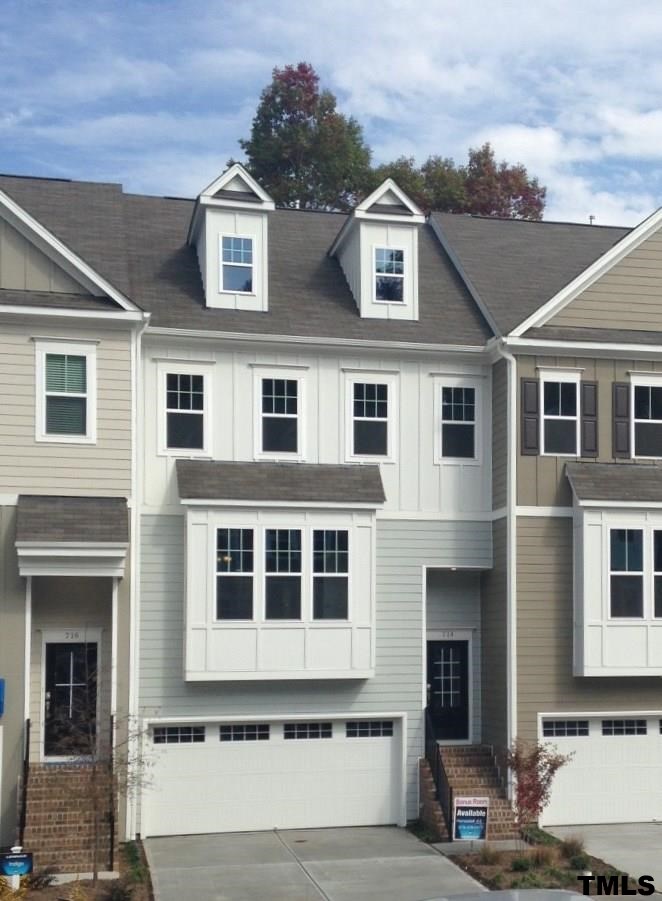 714 Edgewater Ridge Court Apex, NC 27523 - Photo 1 of 8 Brand new 3 story luxury townhomes with 2 car garages back to woods with trail into park.
