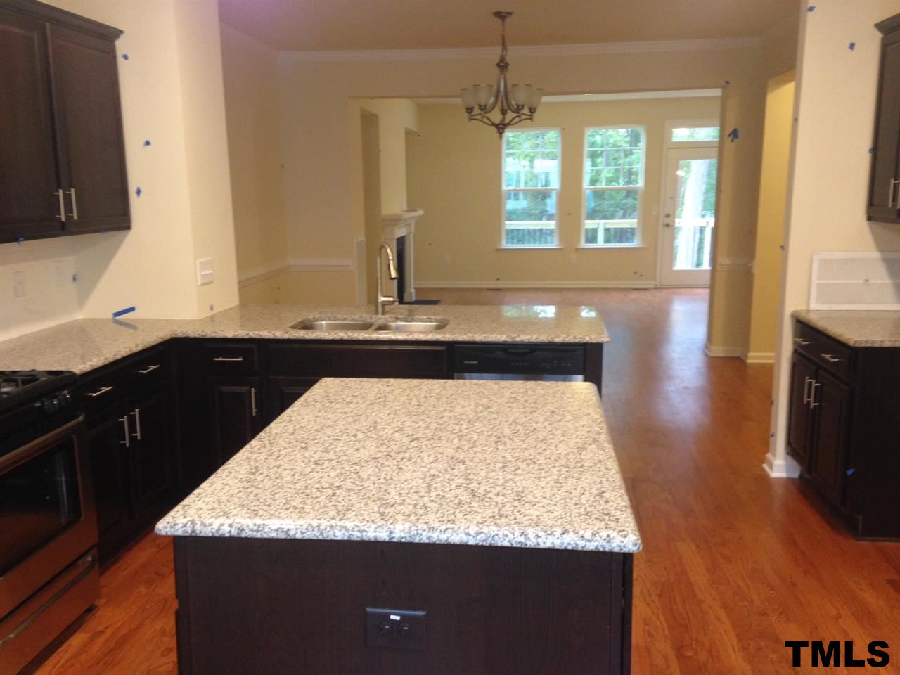 714 Edgewater Ridge Court Apex, NC 27523 - Photo 5 of 8 From eat-in area out to dining room and family room. Open from windows in front to back windows.