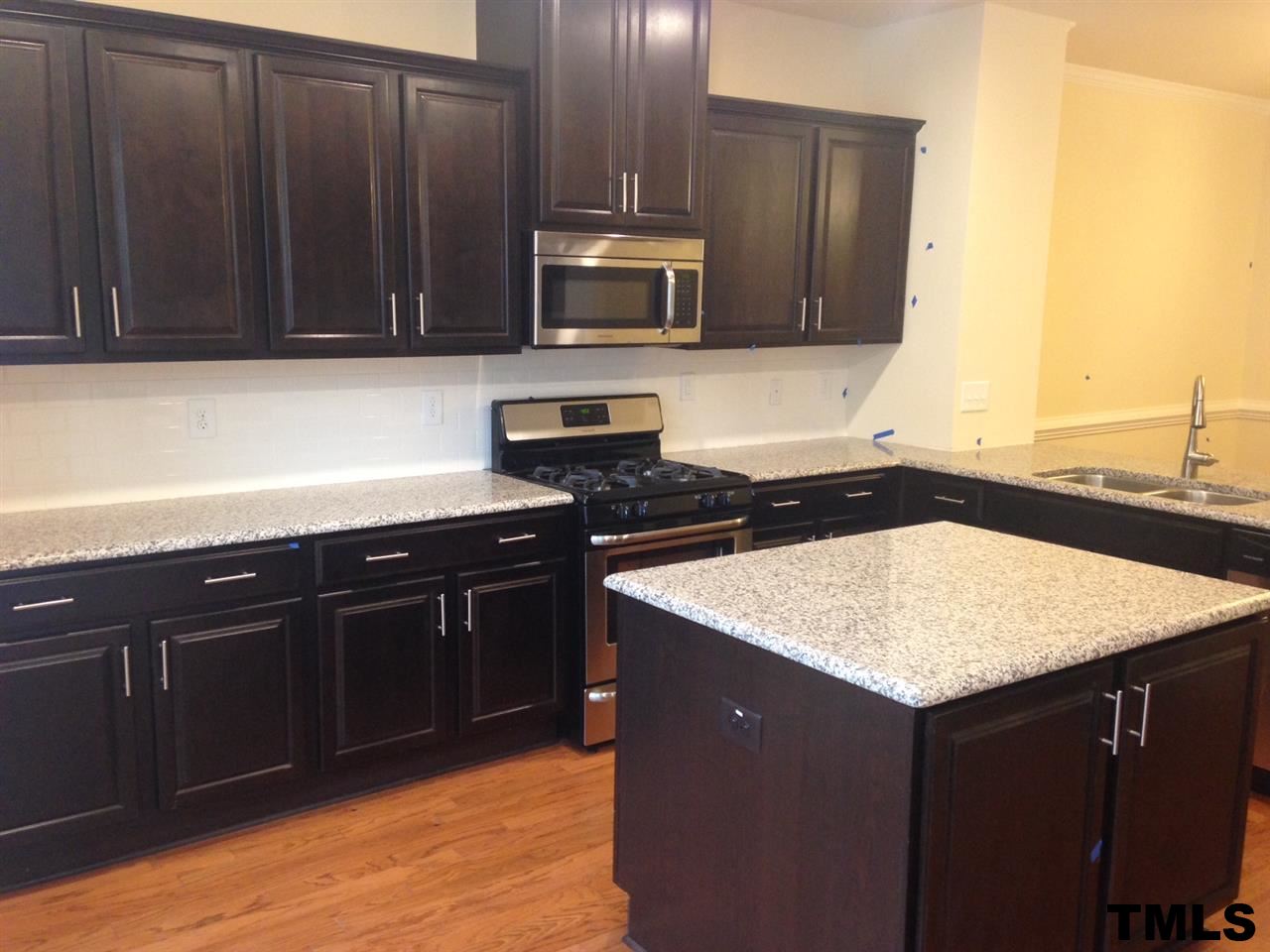714 Edgewater Ridge Court Apex, NC 27523 - Photo 6 of 8 Wonderful island and lots of countertop space.